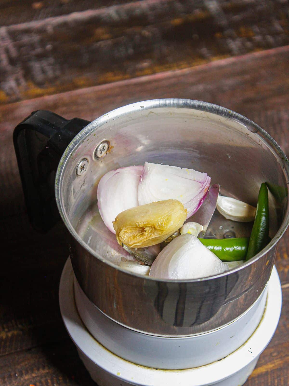 Add all the ingredients of onion paste in a blender 