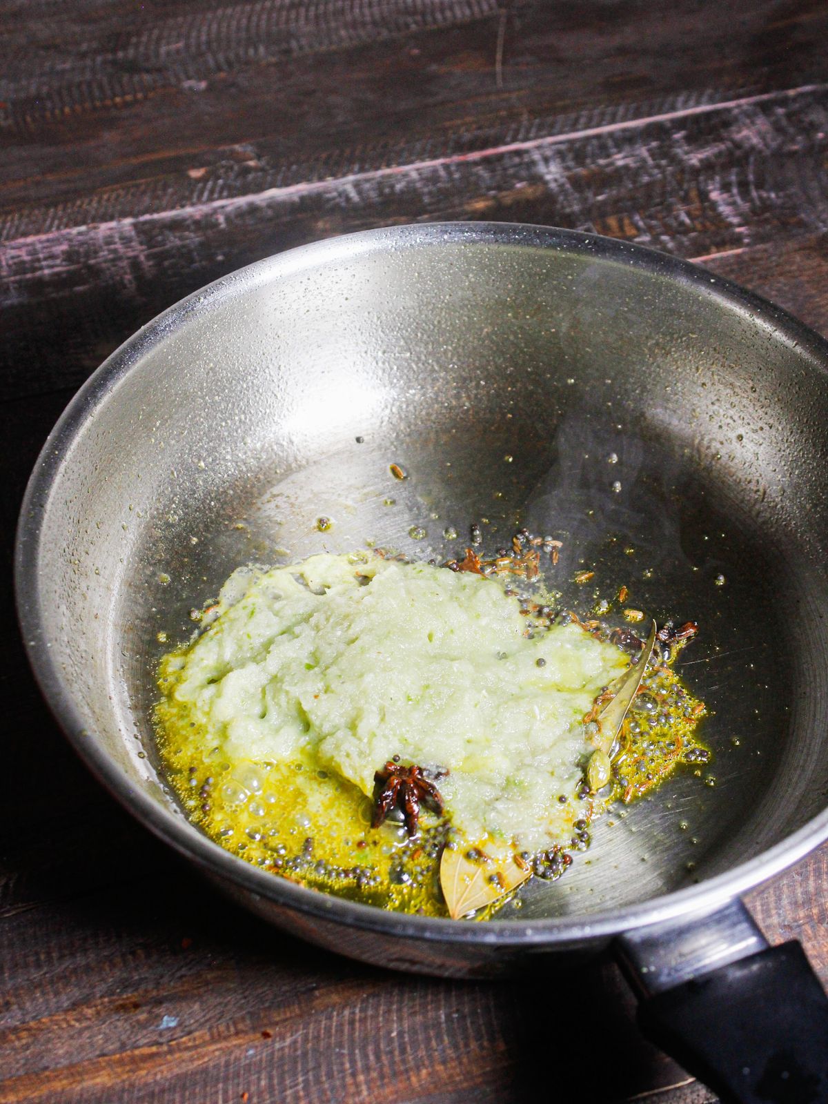 Add onion paste to the pan and mix well