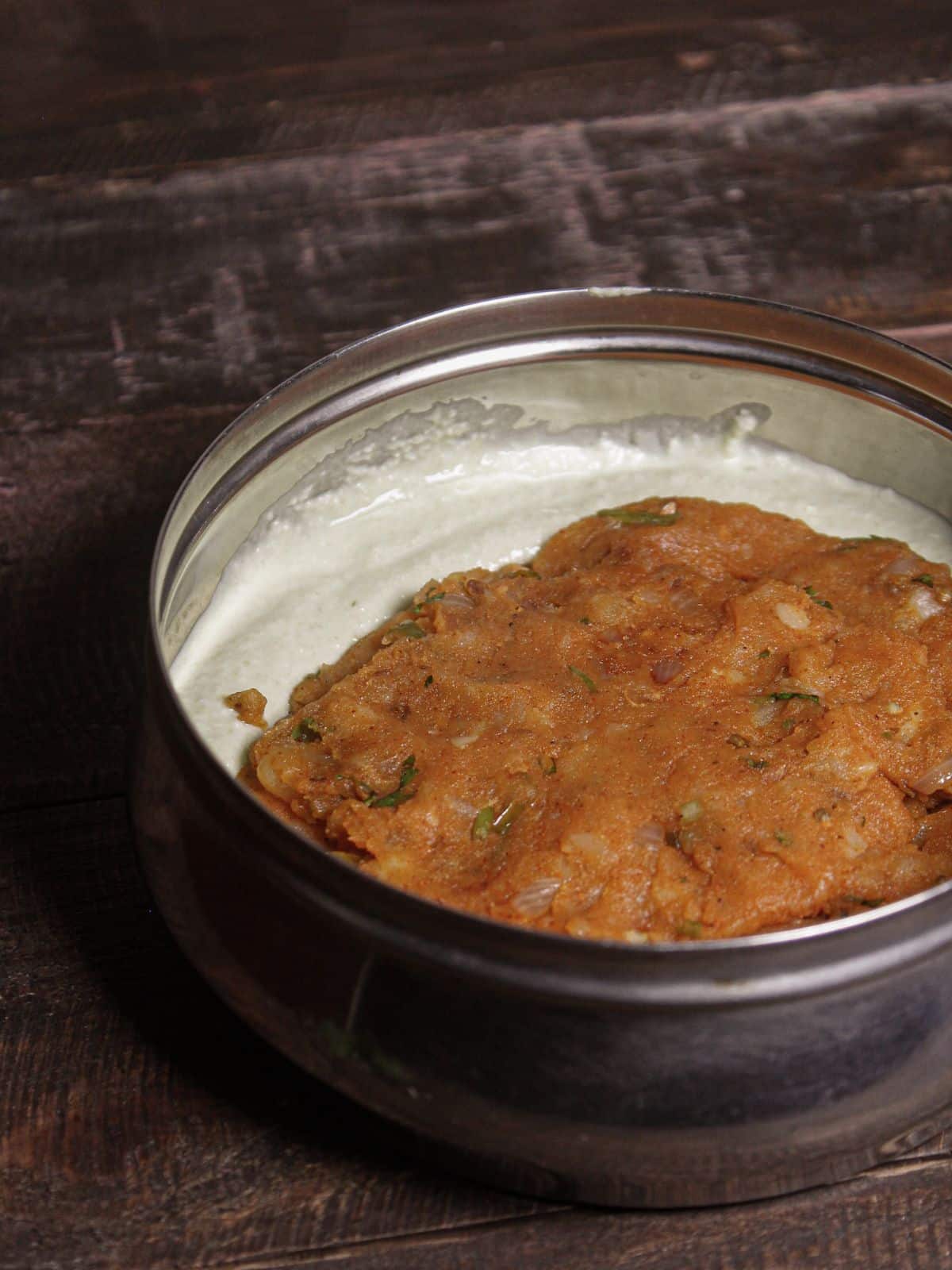 Pour the semolina mixture in a steel container and put potato filling over the base layer 