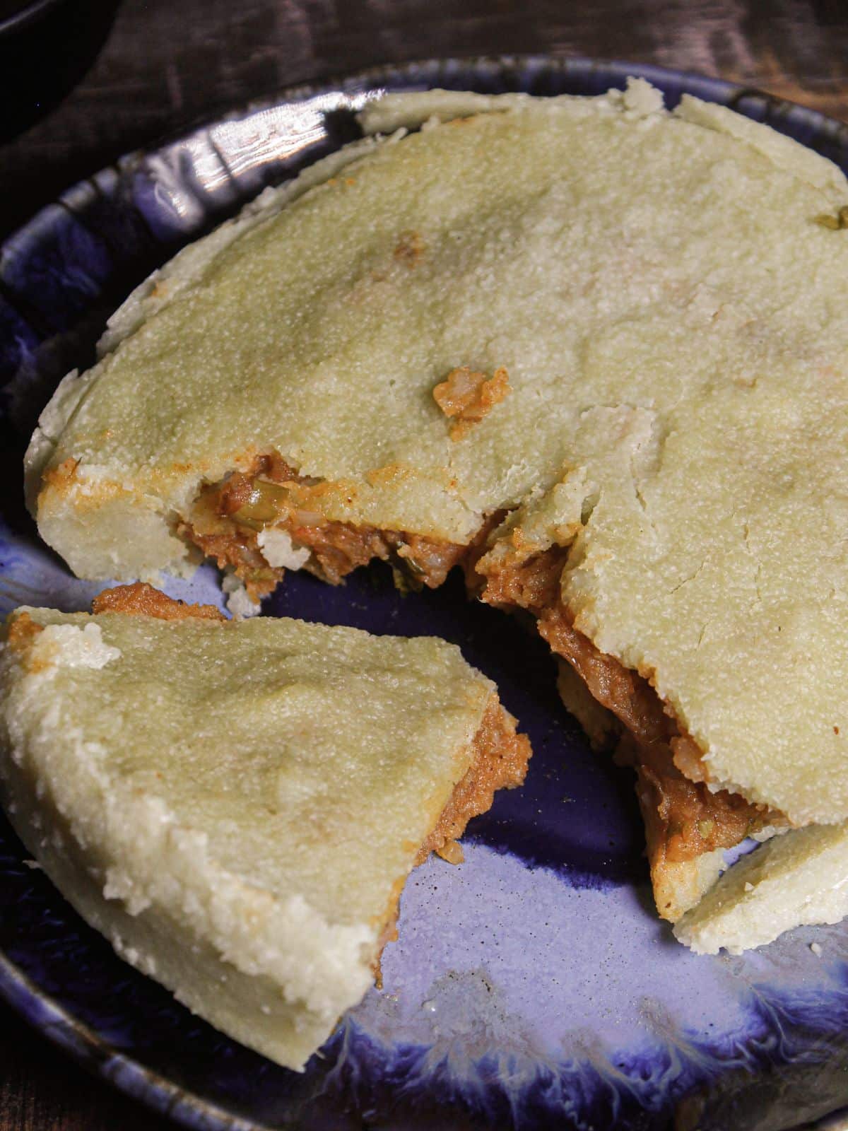 Top view image of Steamed Spicy Potato Stuffed Semolina Cakes