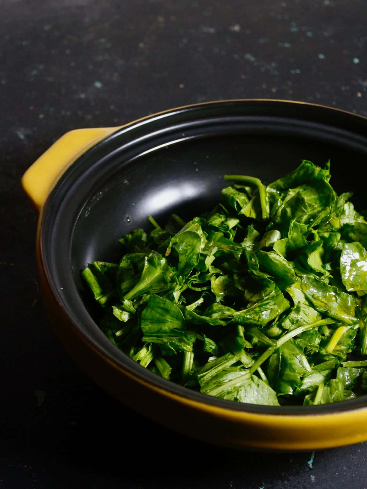 Add chopped spinach with some oil in a pan and cook well 