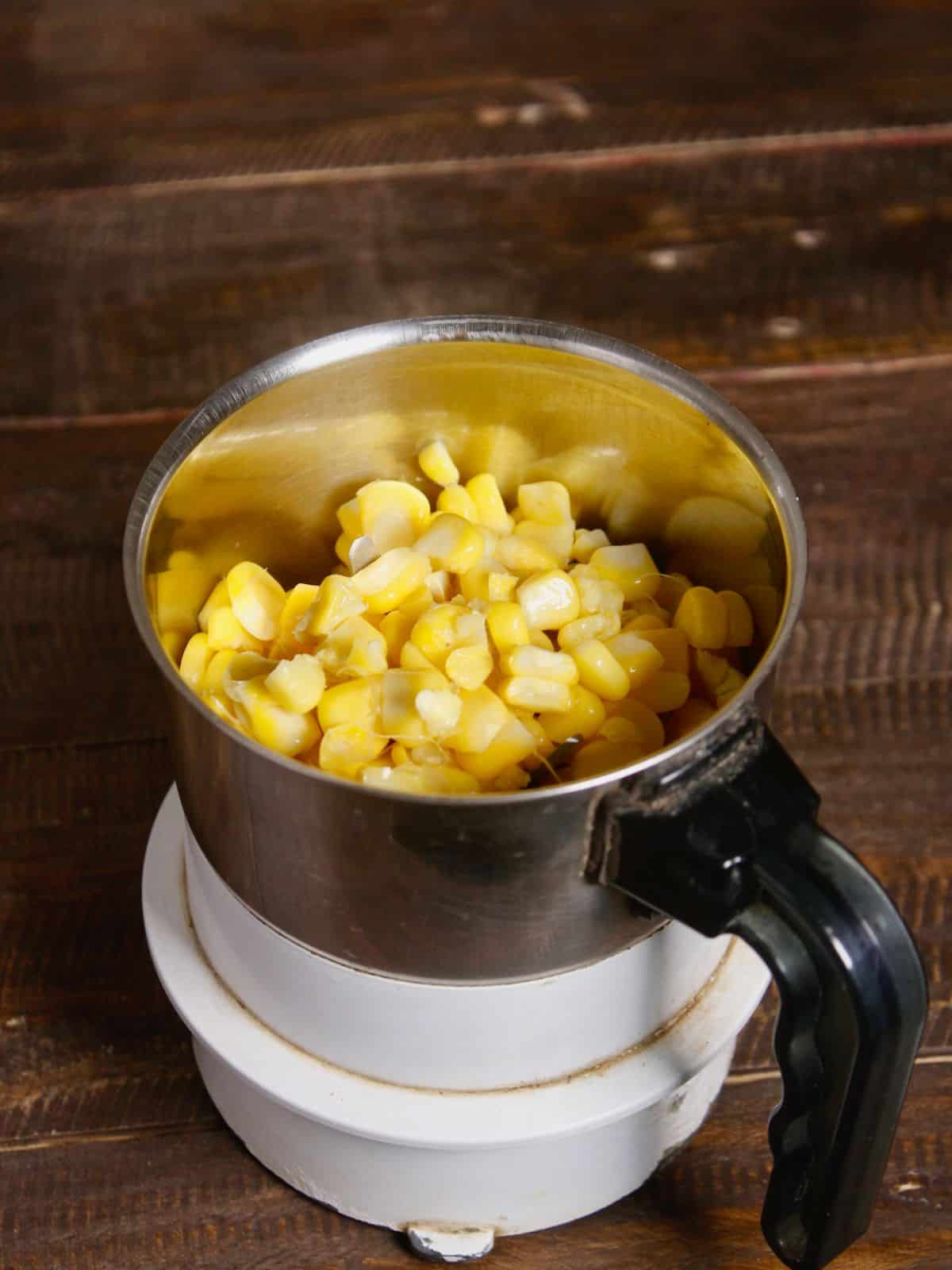 Take boiled corns in the blender 