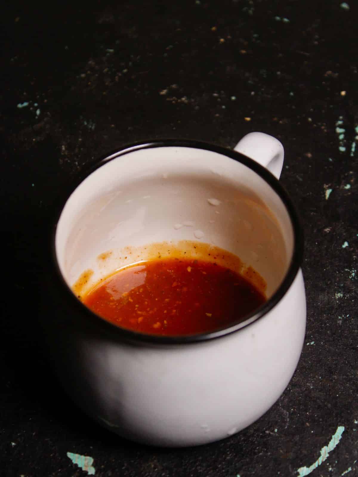 Pour pasta sauce at the bottom of the cup  