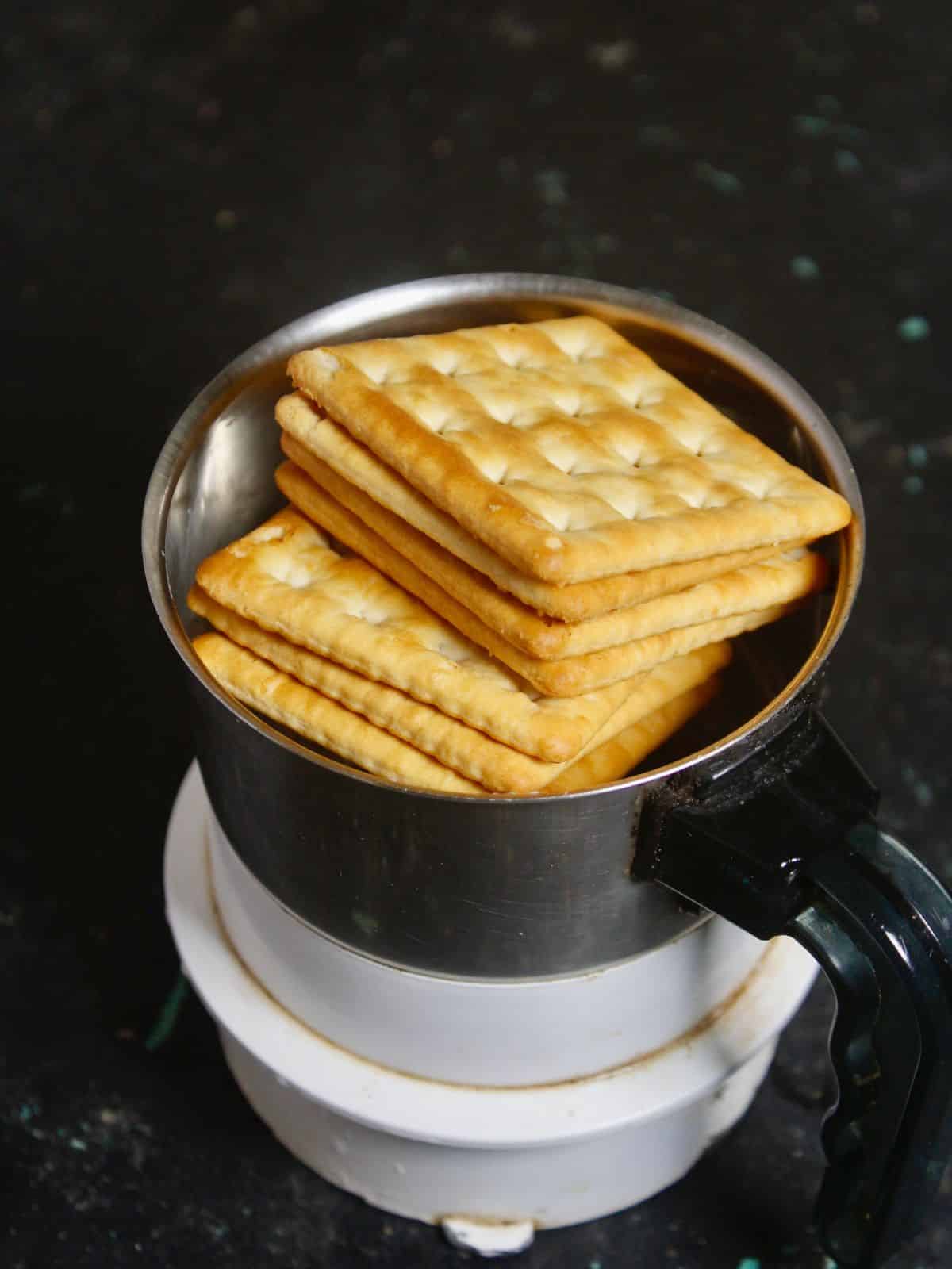 Take biscuits in a food processor and crush it 