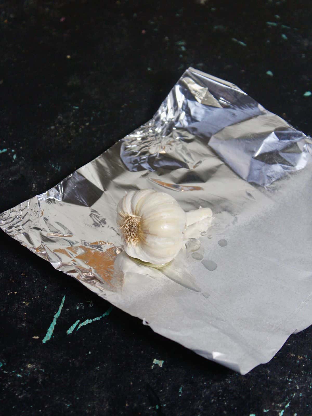 Take garlic along with some oil on a foil paper 