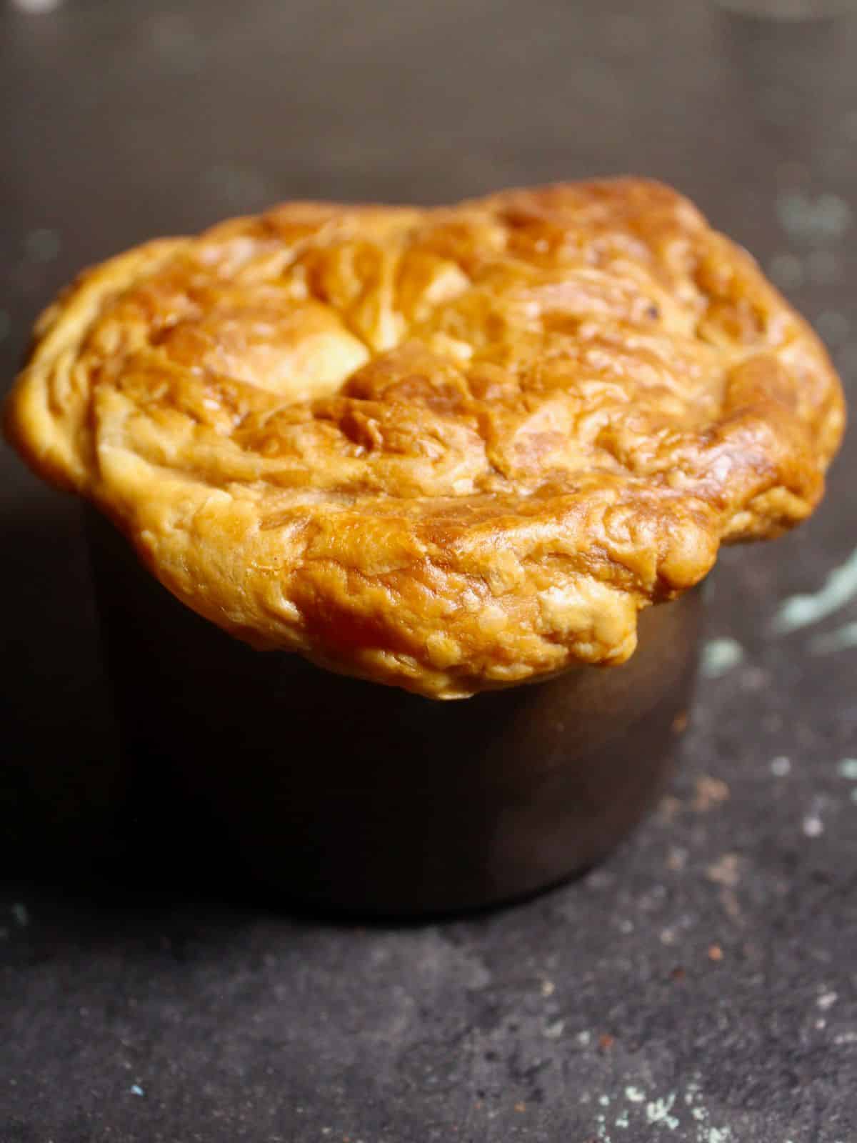 Side view of Indian Spiced Lamb and Vegetable Pies in a Cup