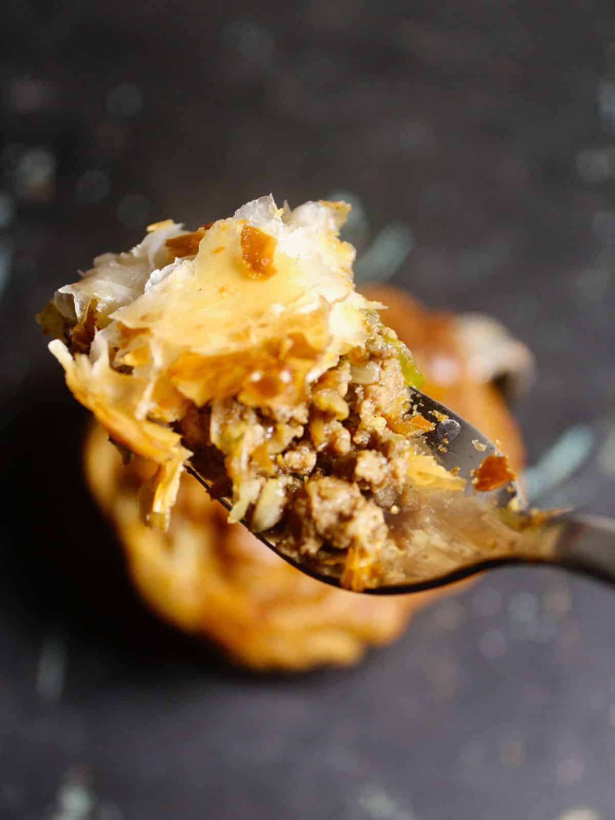 Indian Spiced Lamb and Vegetable Pies in a Cup in a spoon