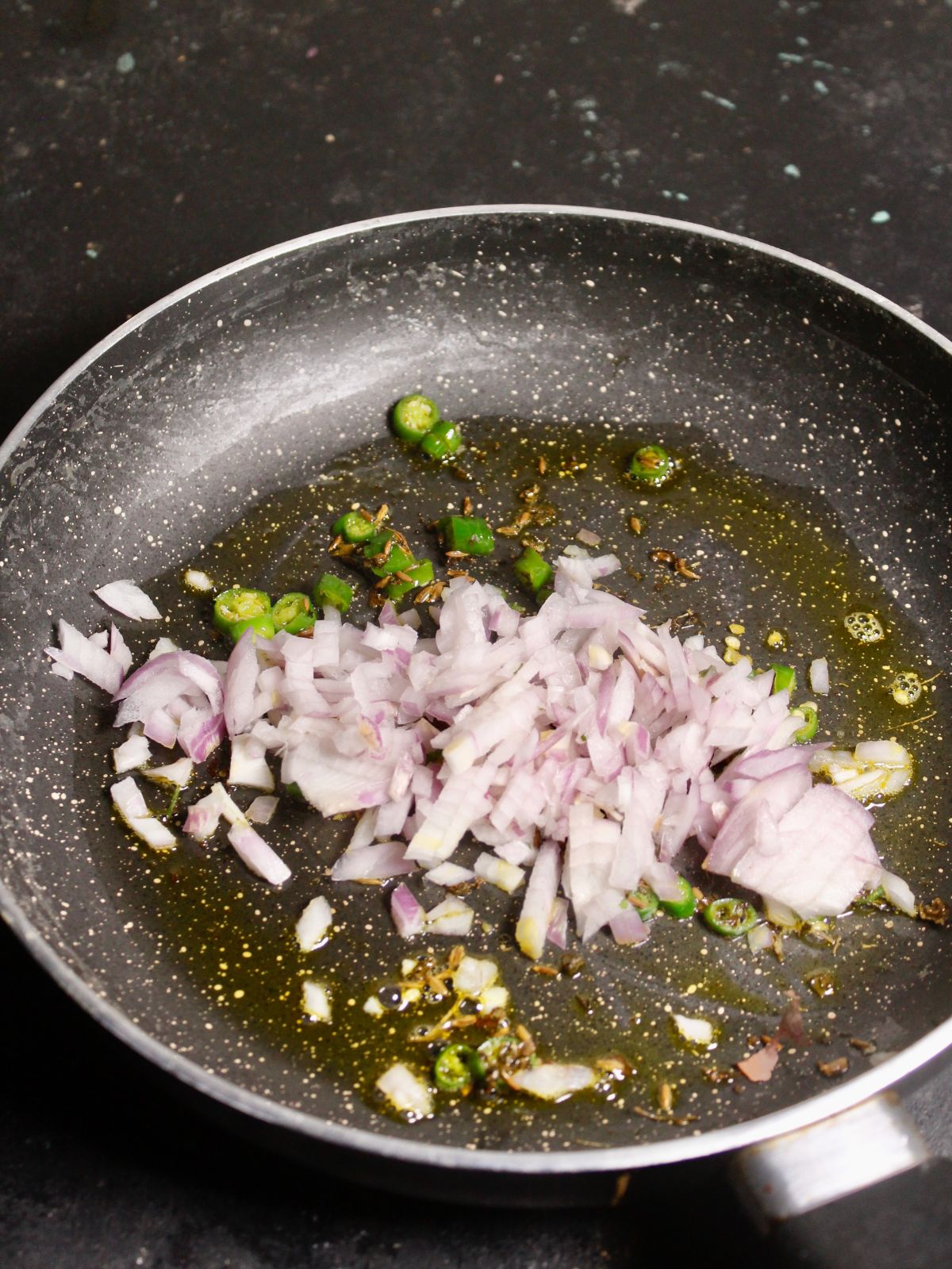 Add chopped onions to the pan and saute 