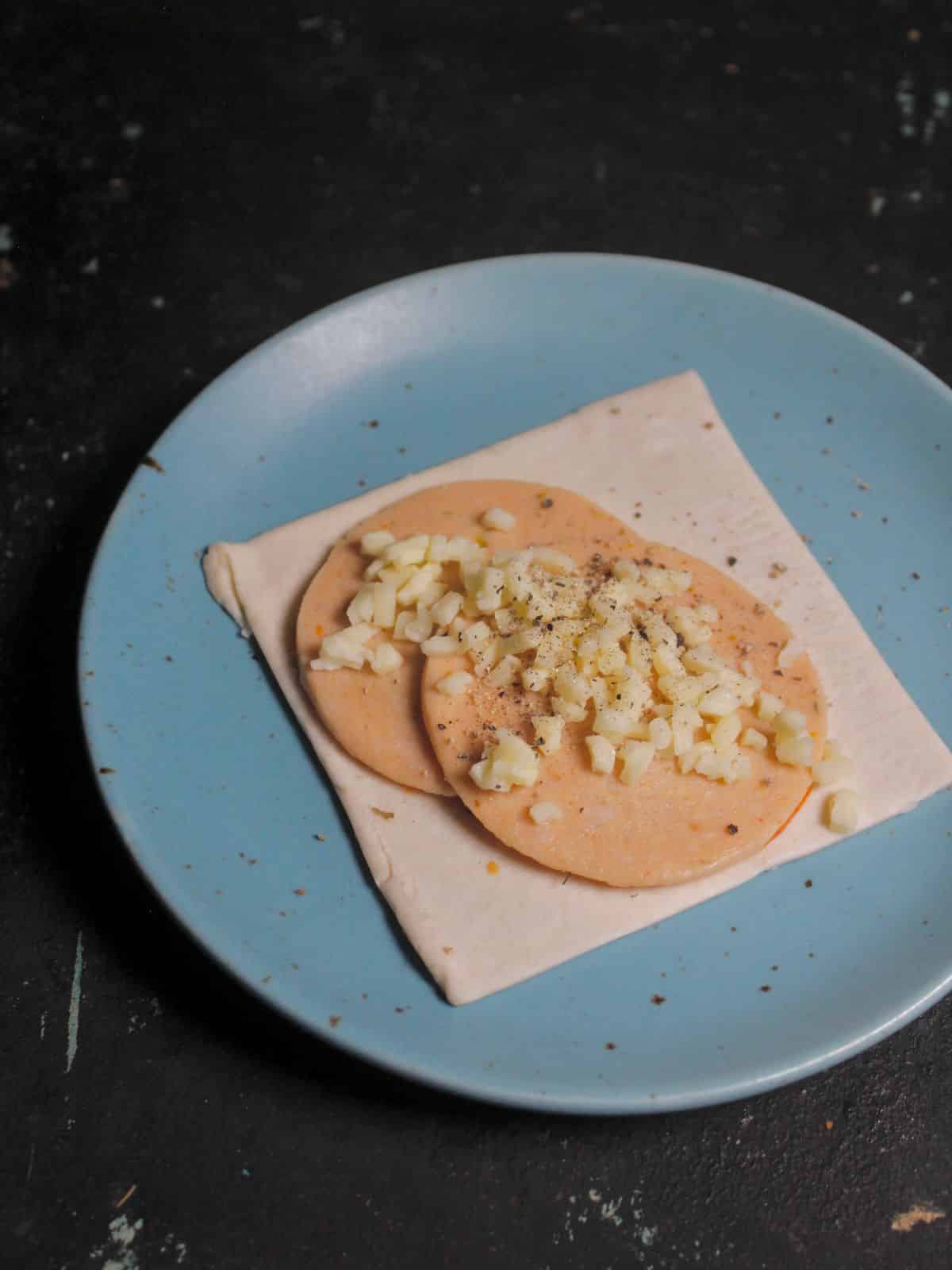 Add some grated cheese and sprinkle some mixed herbs over it  