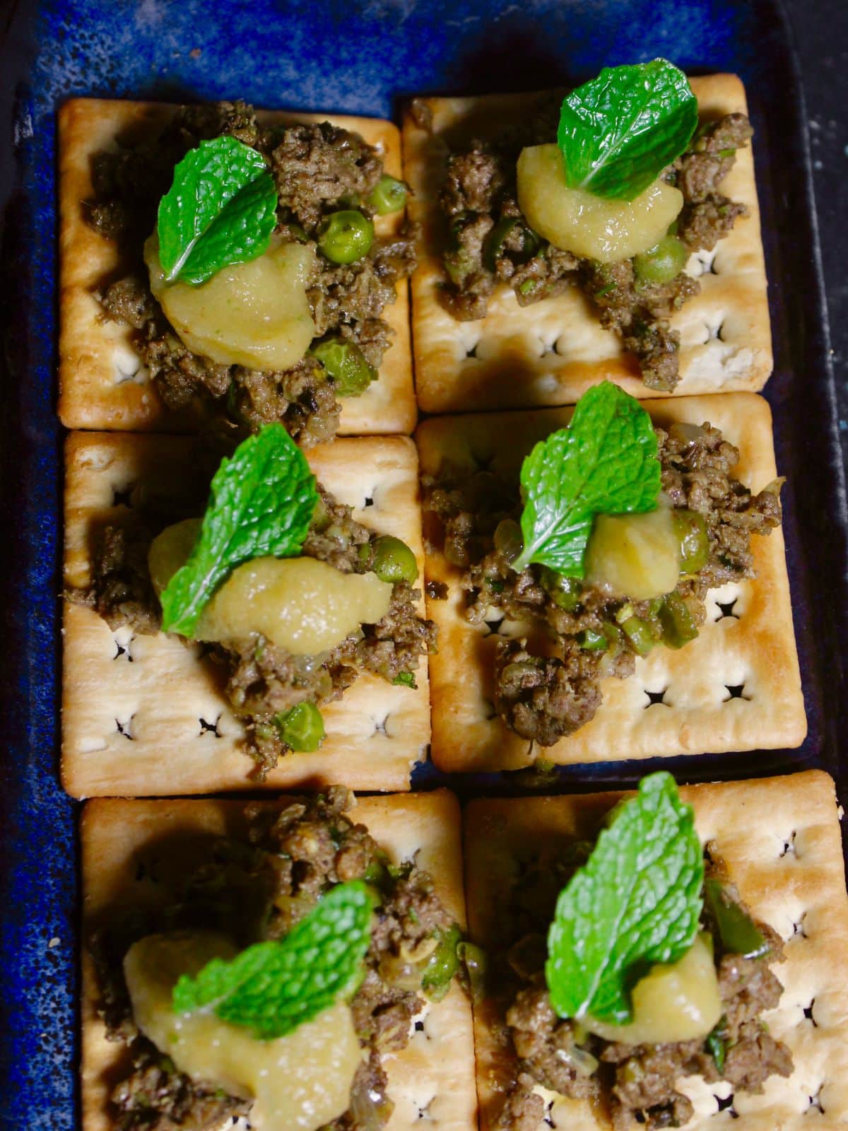 Top view of Minced Lamb Canapes with Spicy Tangy Dressing
