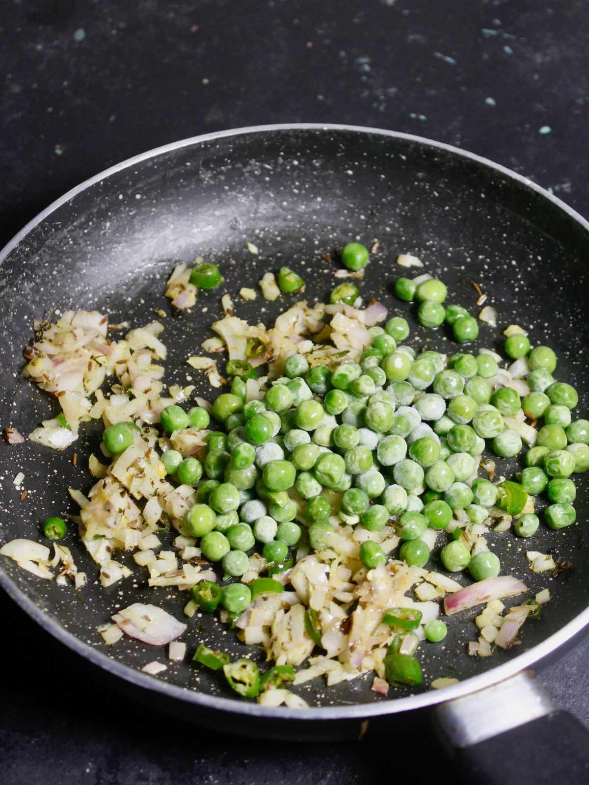 Add green peas to the pan 