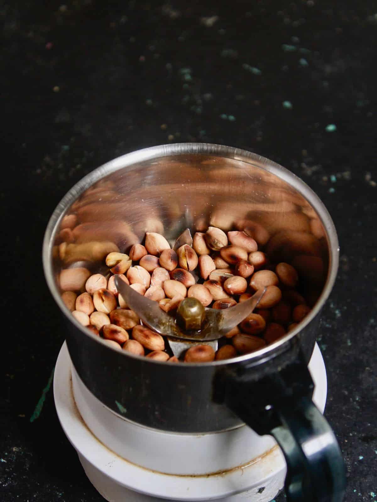 Take roasted peanuts in a food processor 
