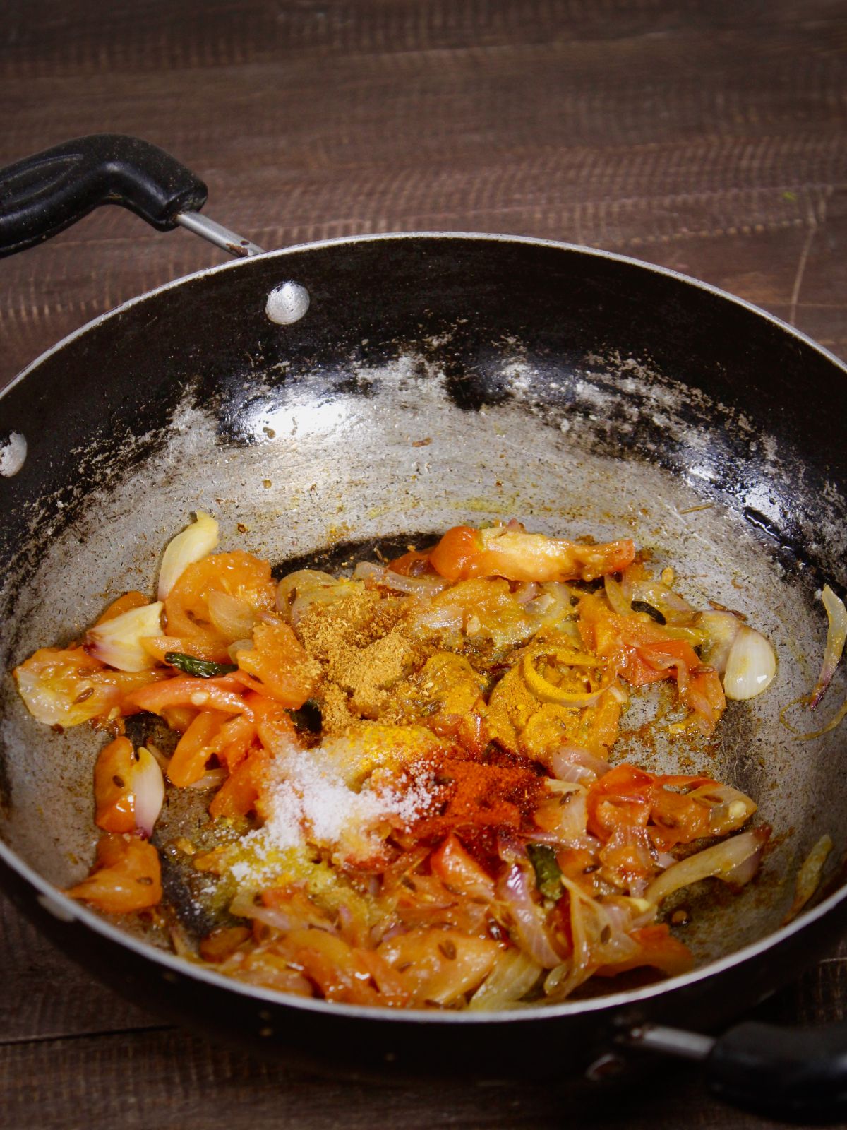 add powdered spices to the pan and saute 