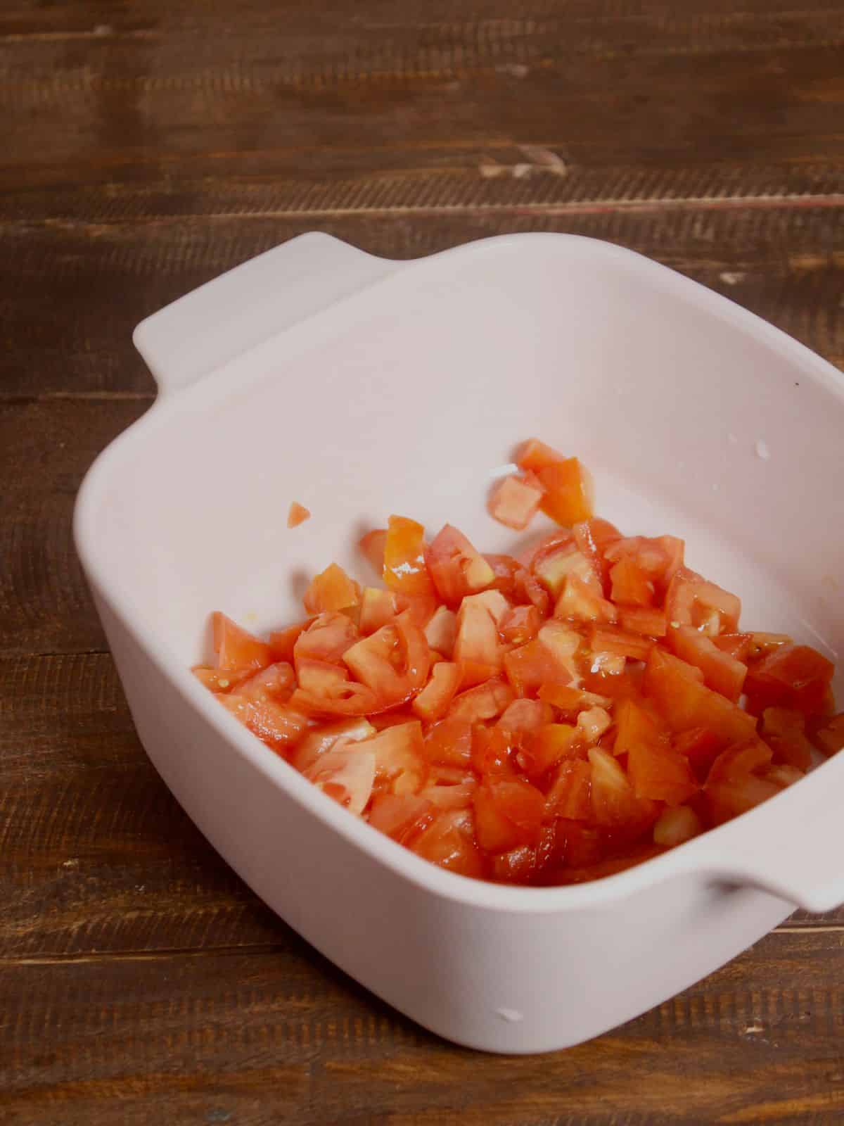 chopped tomatoes and olive oil in a casserole 