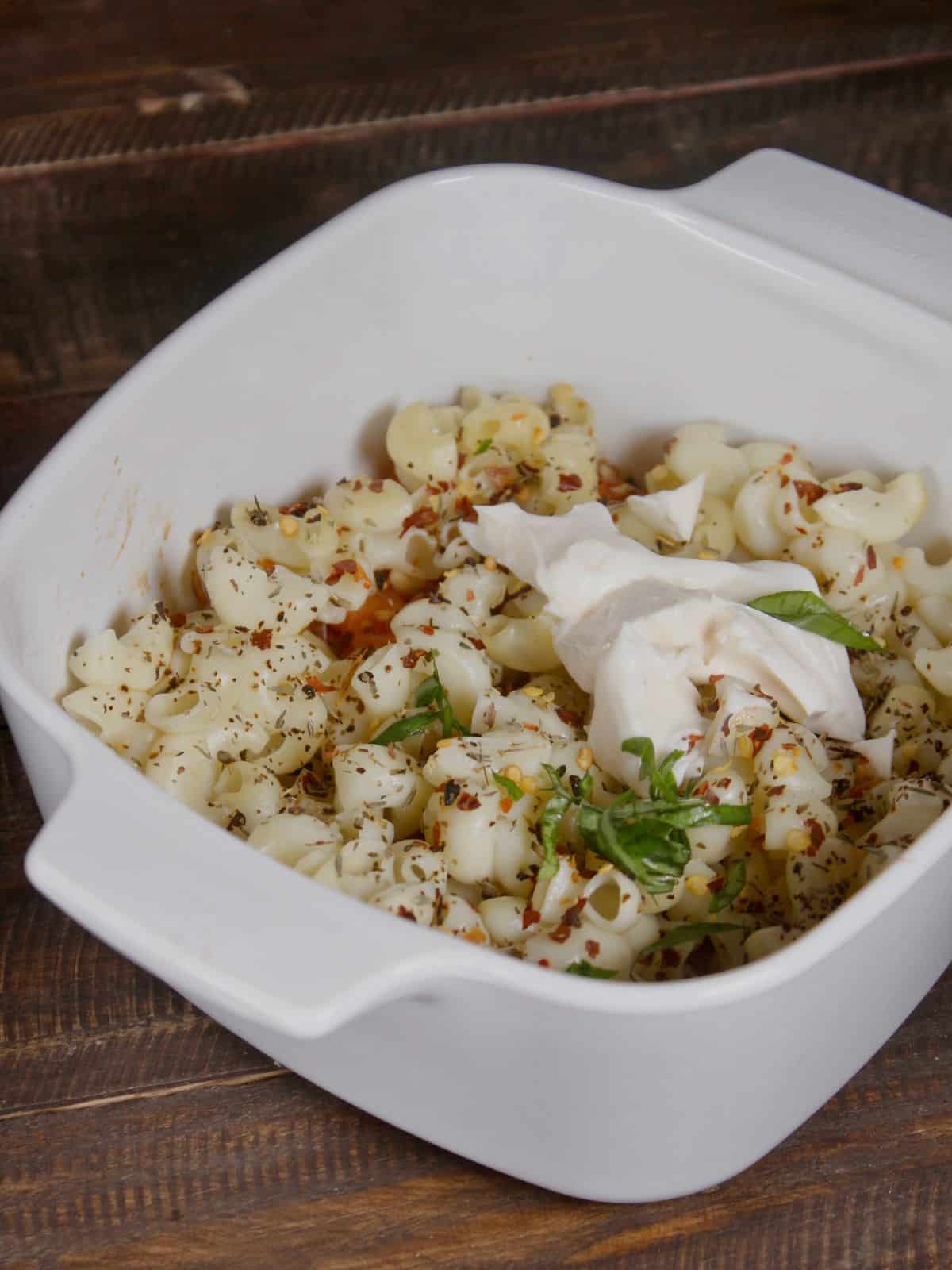 add seasonings and basil leaves to the casserole 