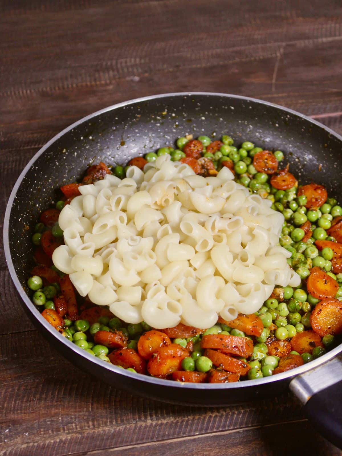 add boiled pasta to the pan 