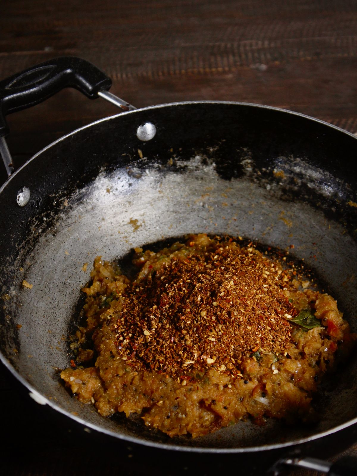 Add chettinad masala in the pan and mix well