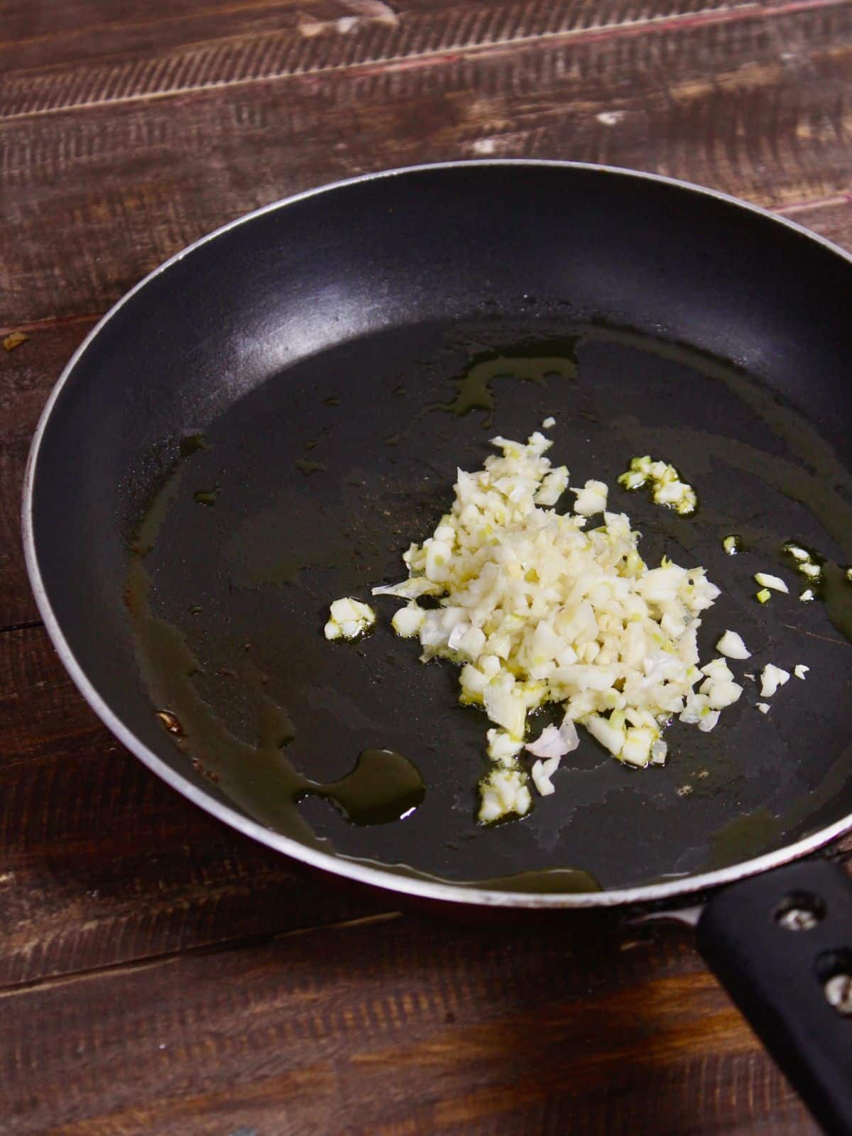 add minced garlic with oil in a pan 