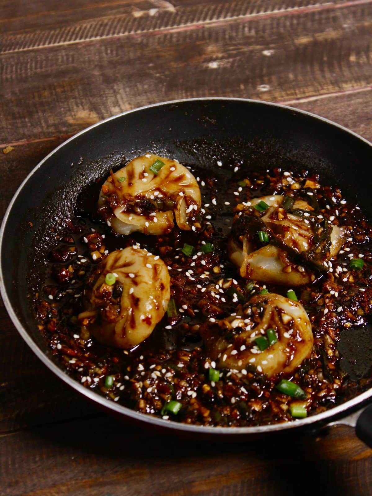 garnish dumplings with sesame seeds and green onions and enjoy 