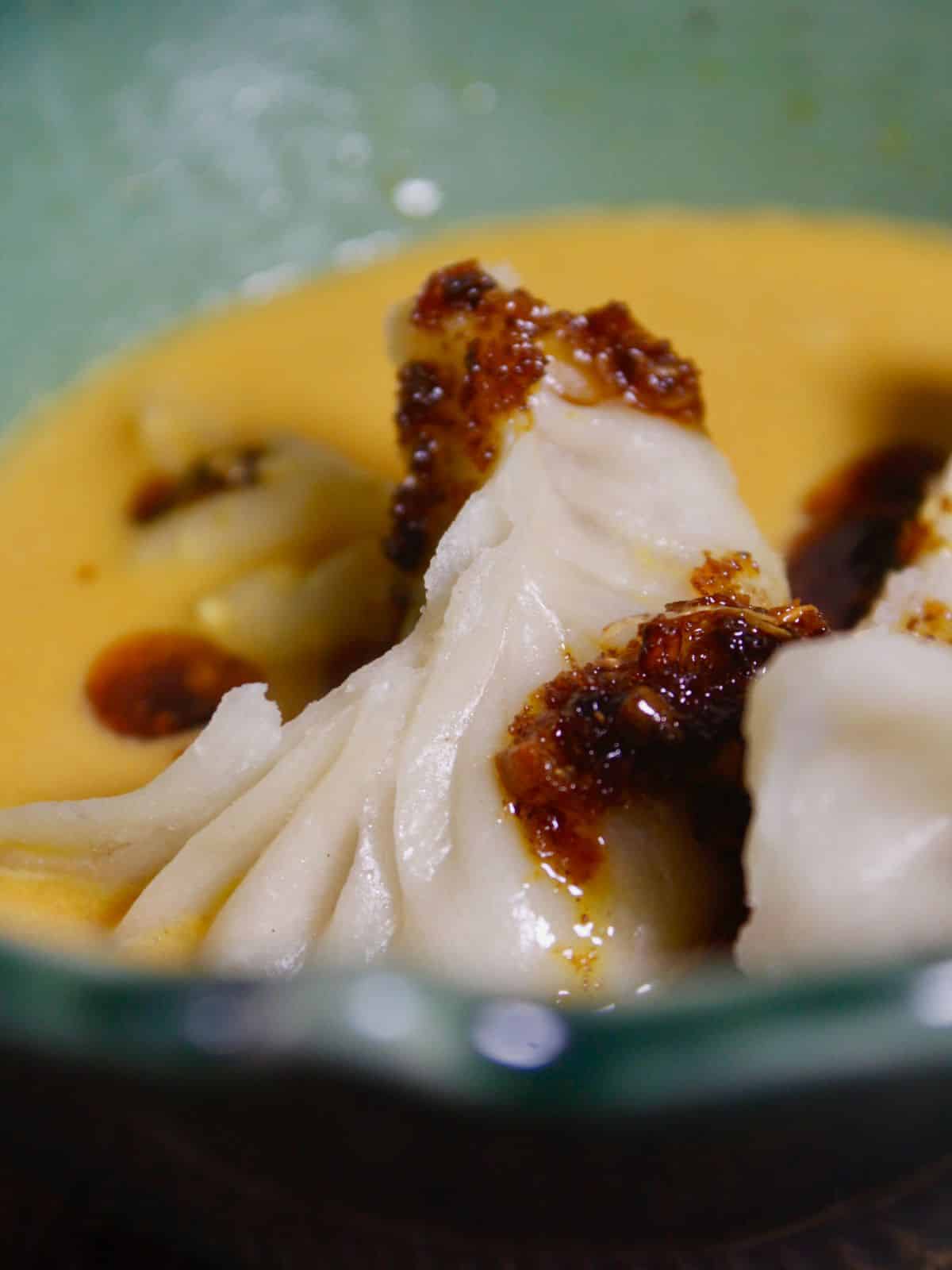 Tasty dumplings in peanut sauce