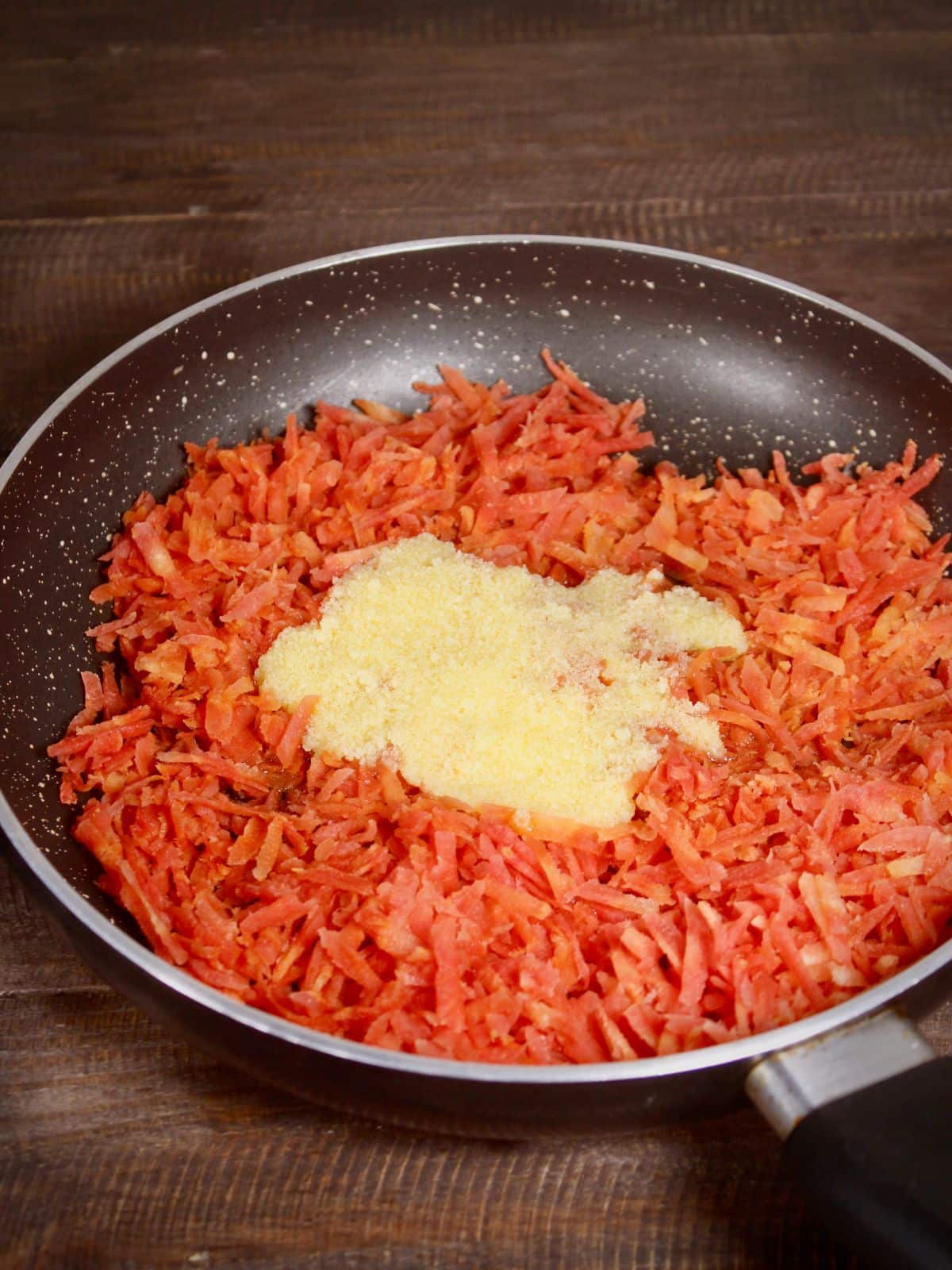 add sugar and ghee to the pan 