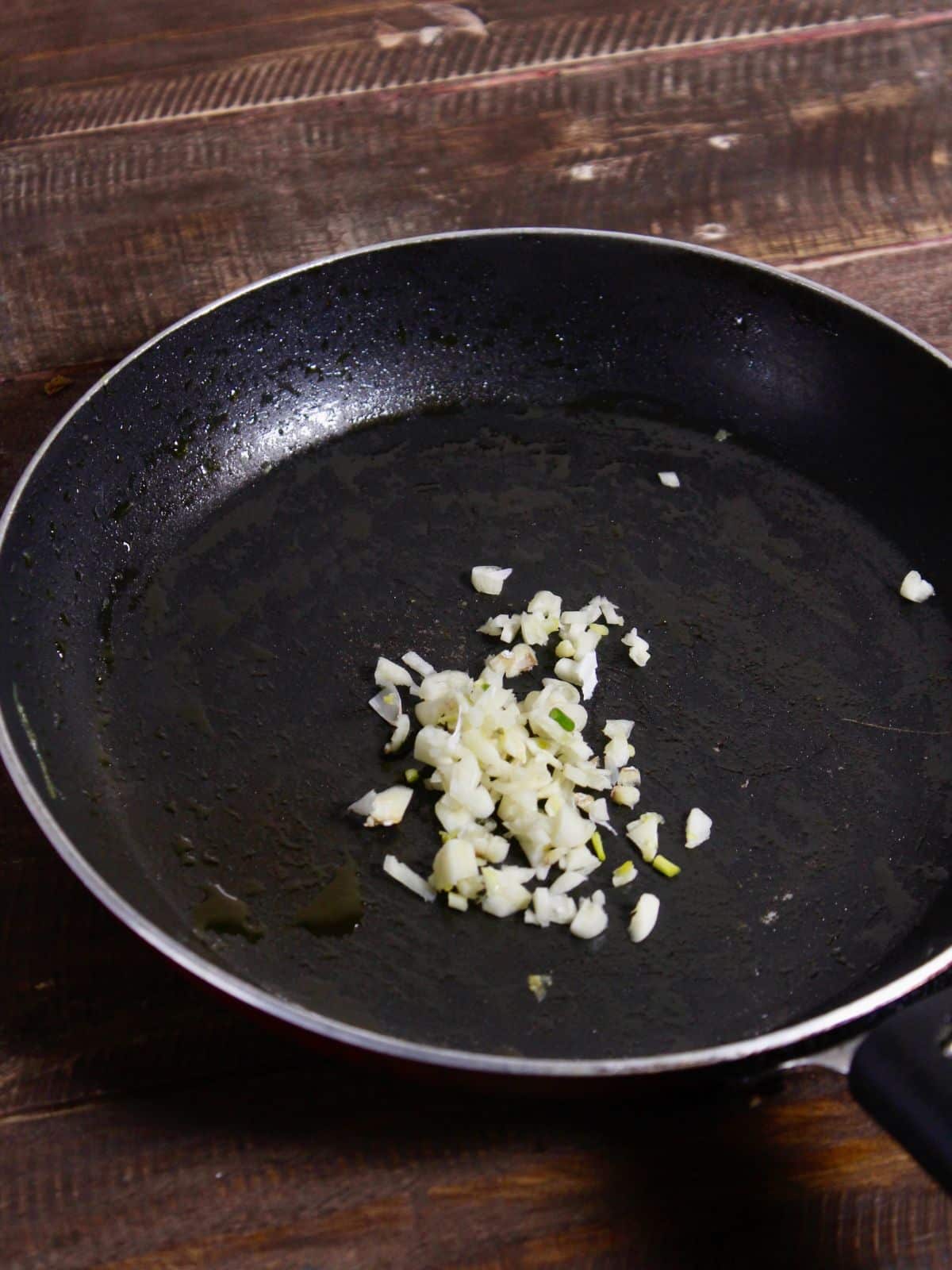 take minced garlic and oil in a pan 