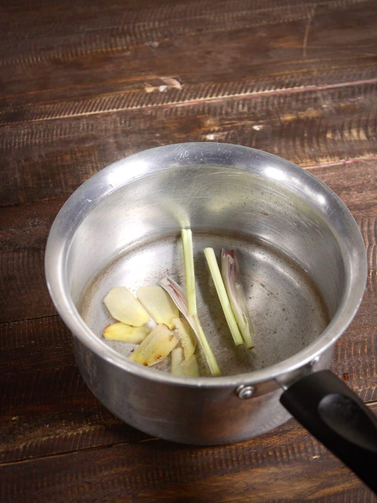 Add lemongrass and ginger in the pan 