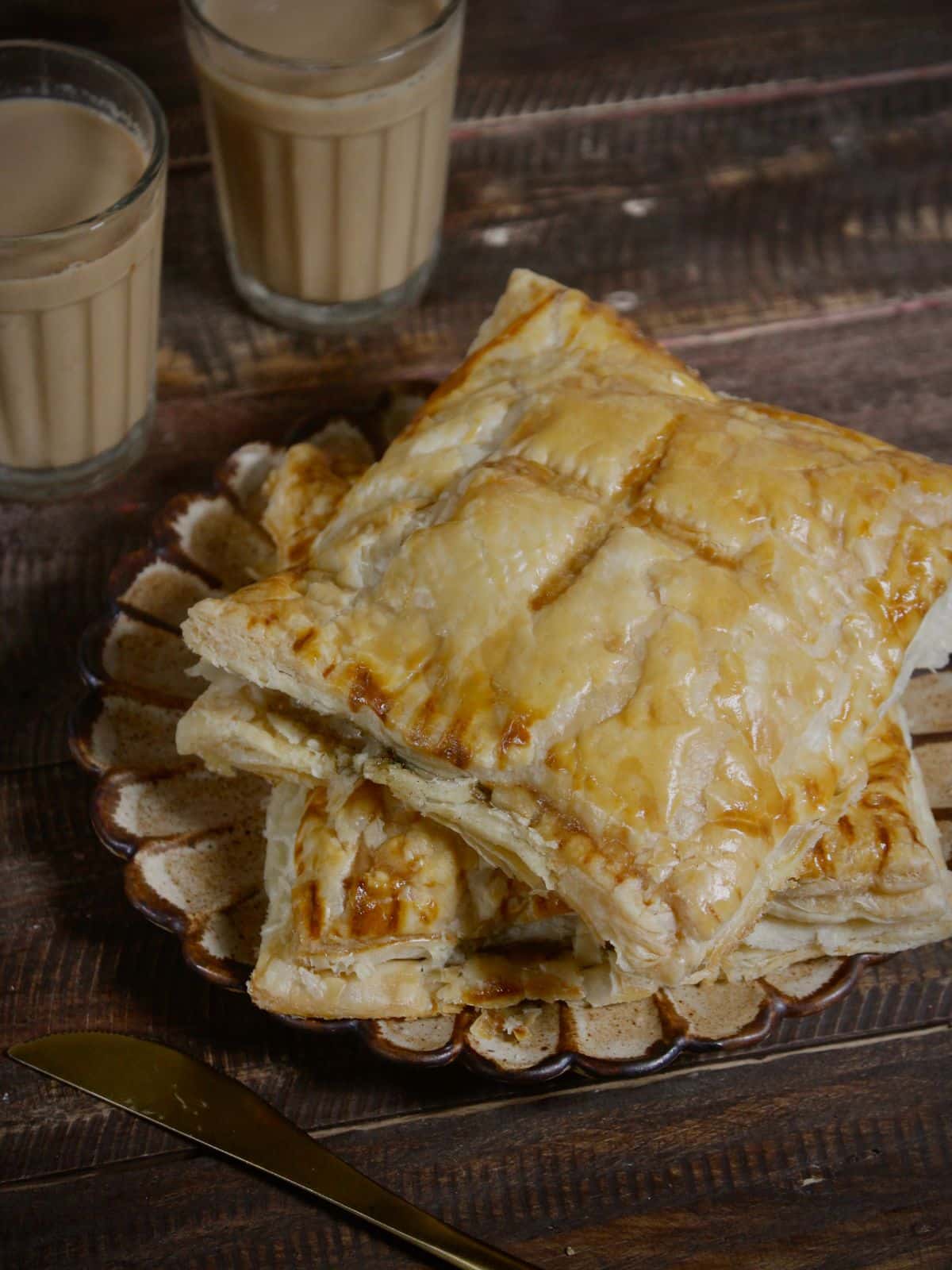 Super Delicious spinach and corn puff pastry with lemongrass ginger tea in the background