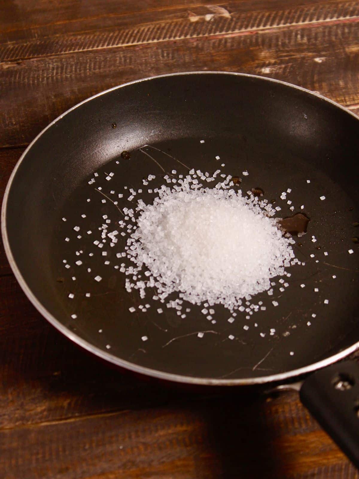 take sugar in a pan and caramelize it 