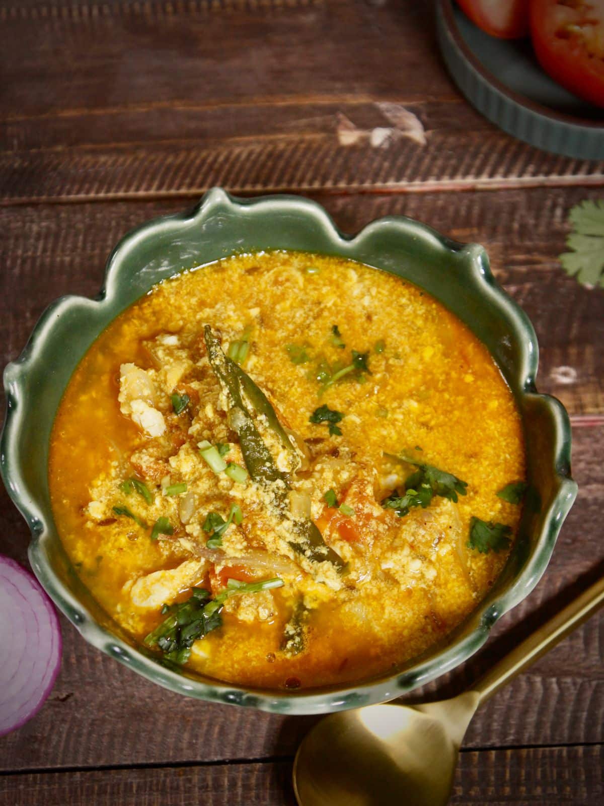 Top view of Assamese style tomato egg curry