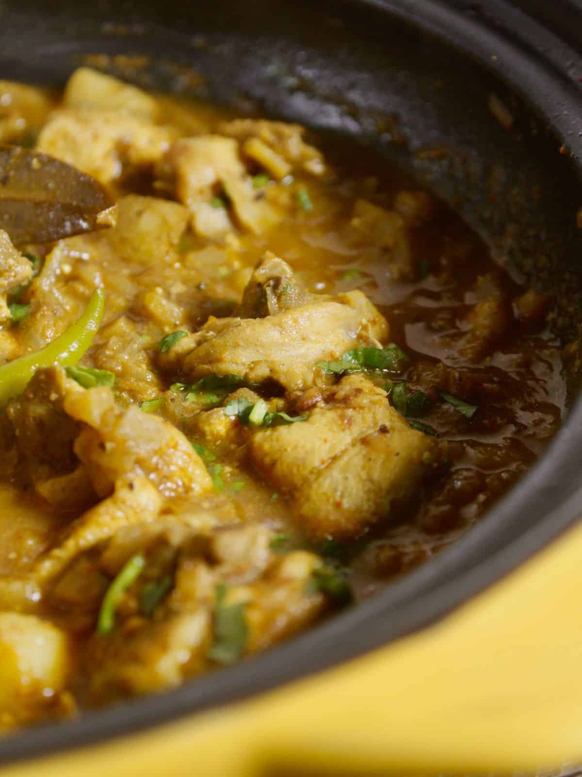 side view zoom in image of banana stem chicken curry