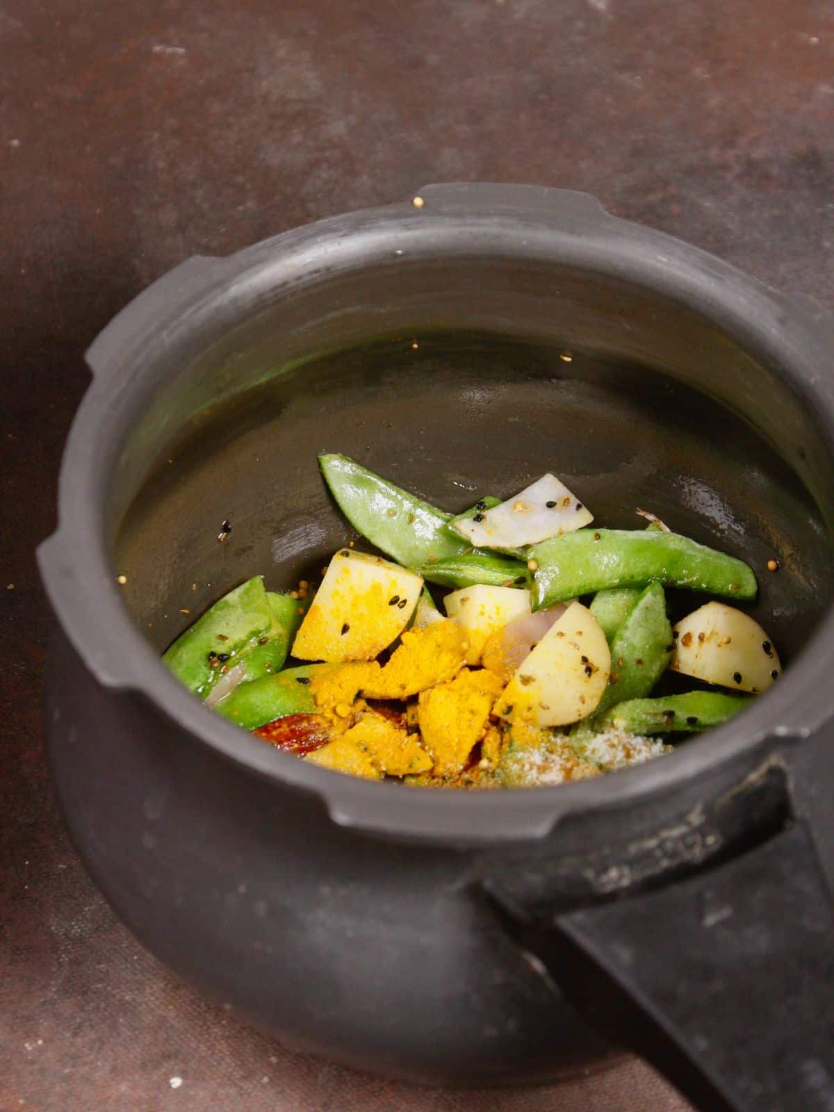 add powdered spices to the pressure cooker 