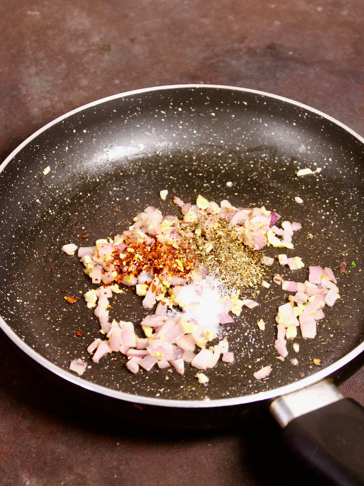 add powdered spices to the pan and mix well 