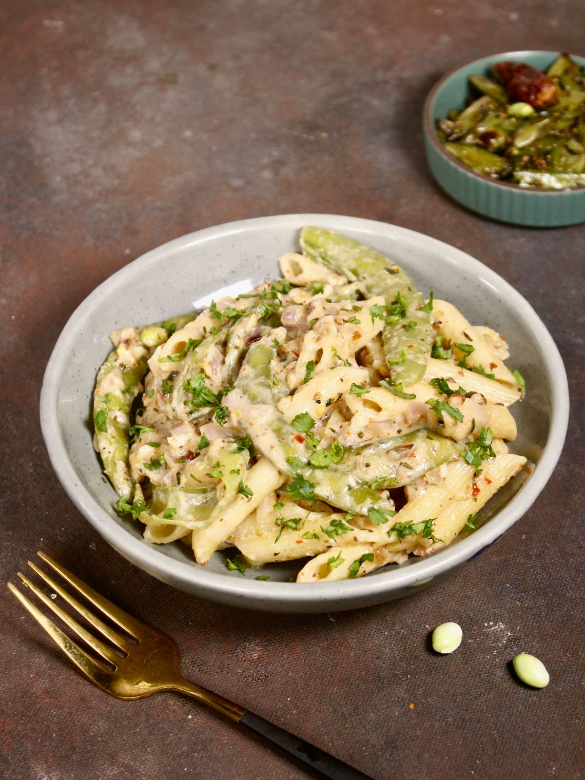 super delicious broad beans pasta in a bowl and fork on the side 