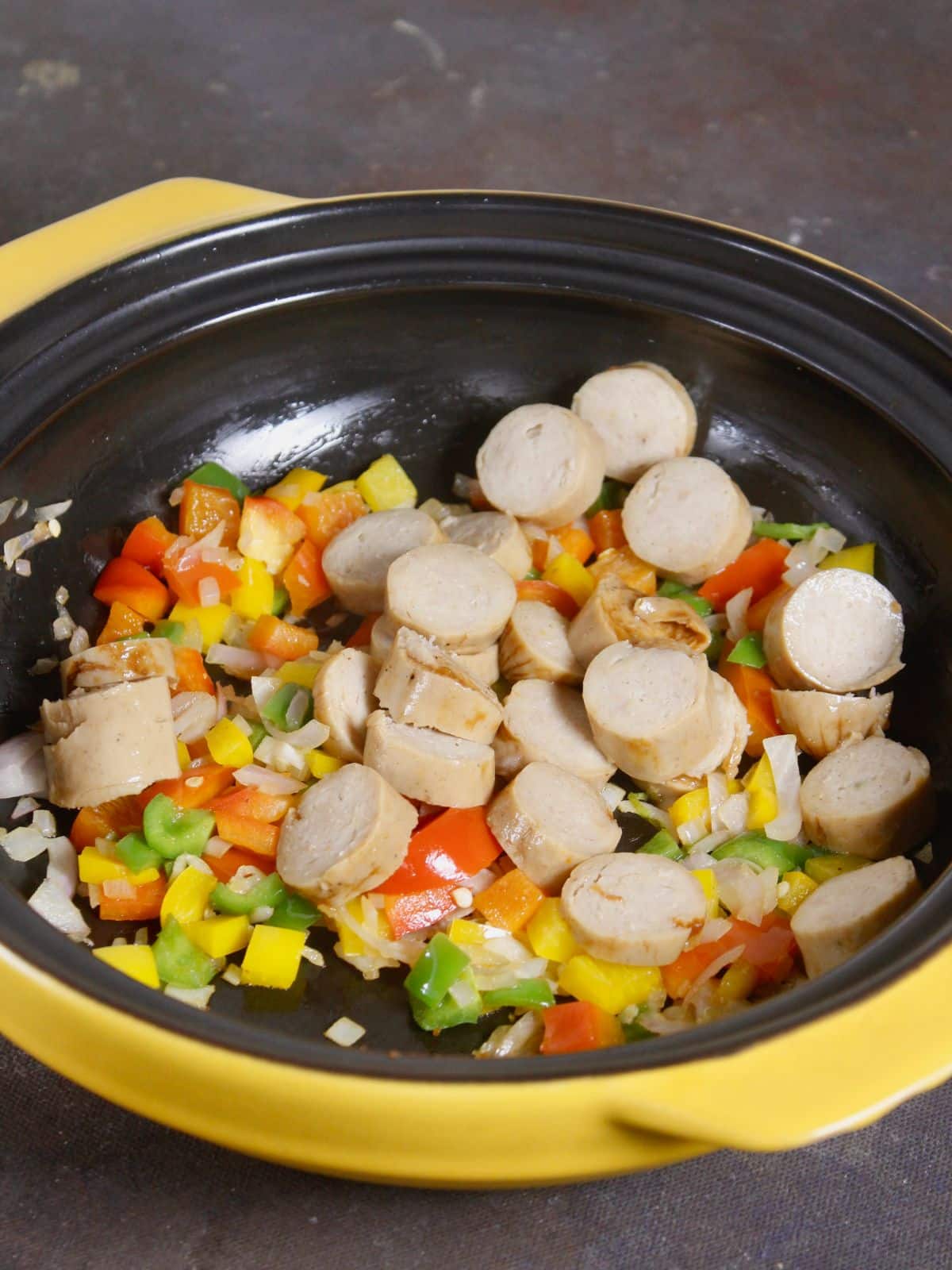 add diced sausages to the pan and mix well