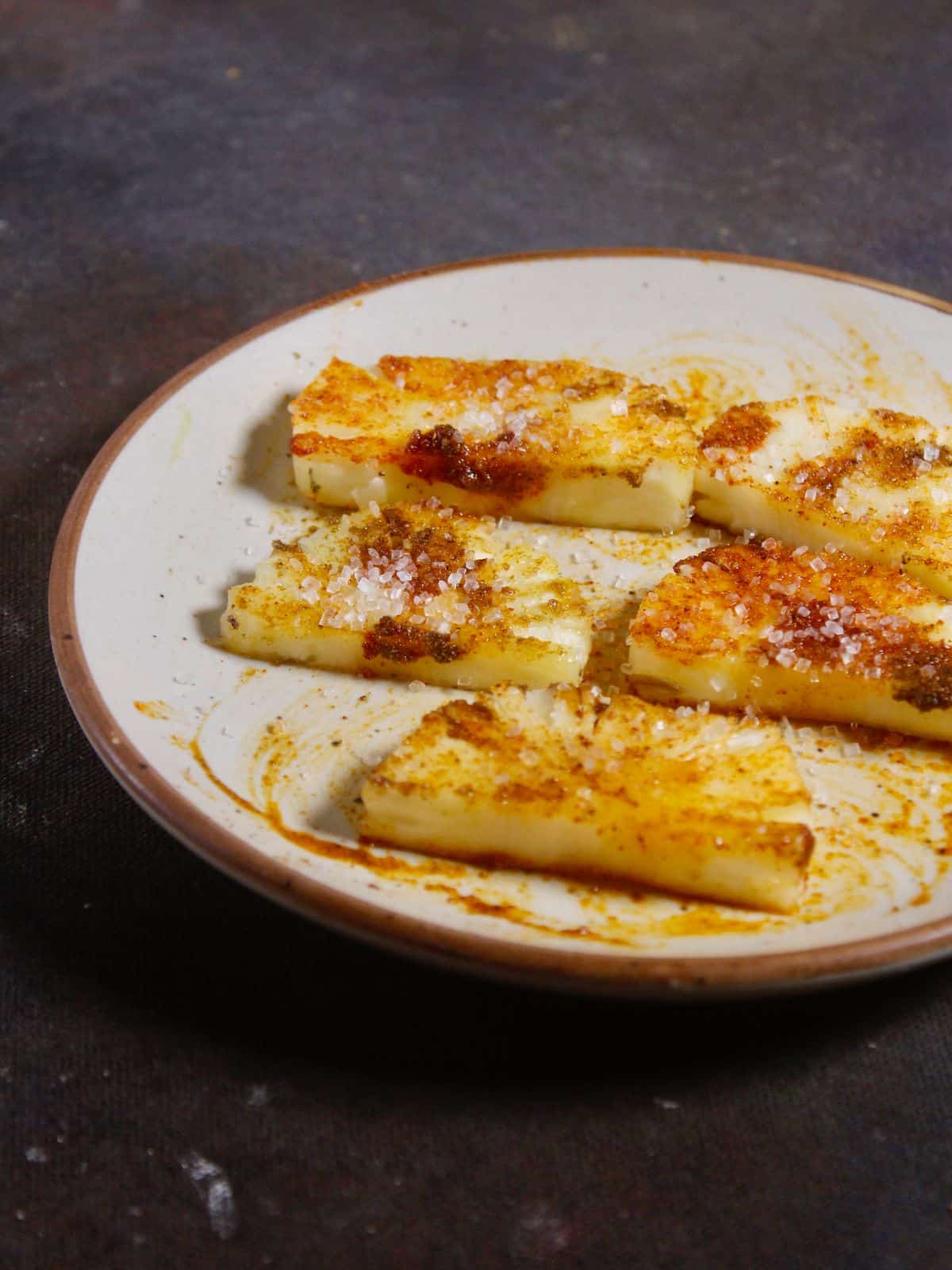 sprinkle sugar over the coated pineapple slices