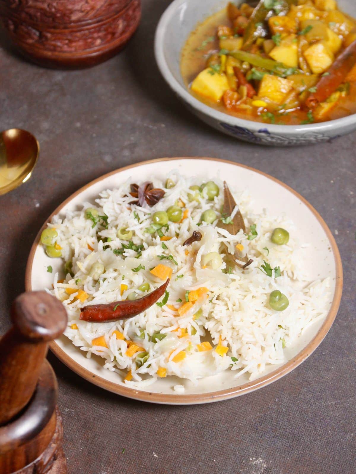 garnish ghee vegetable pulao with fresh coriander leaves and serve hot  