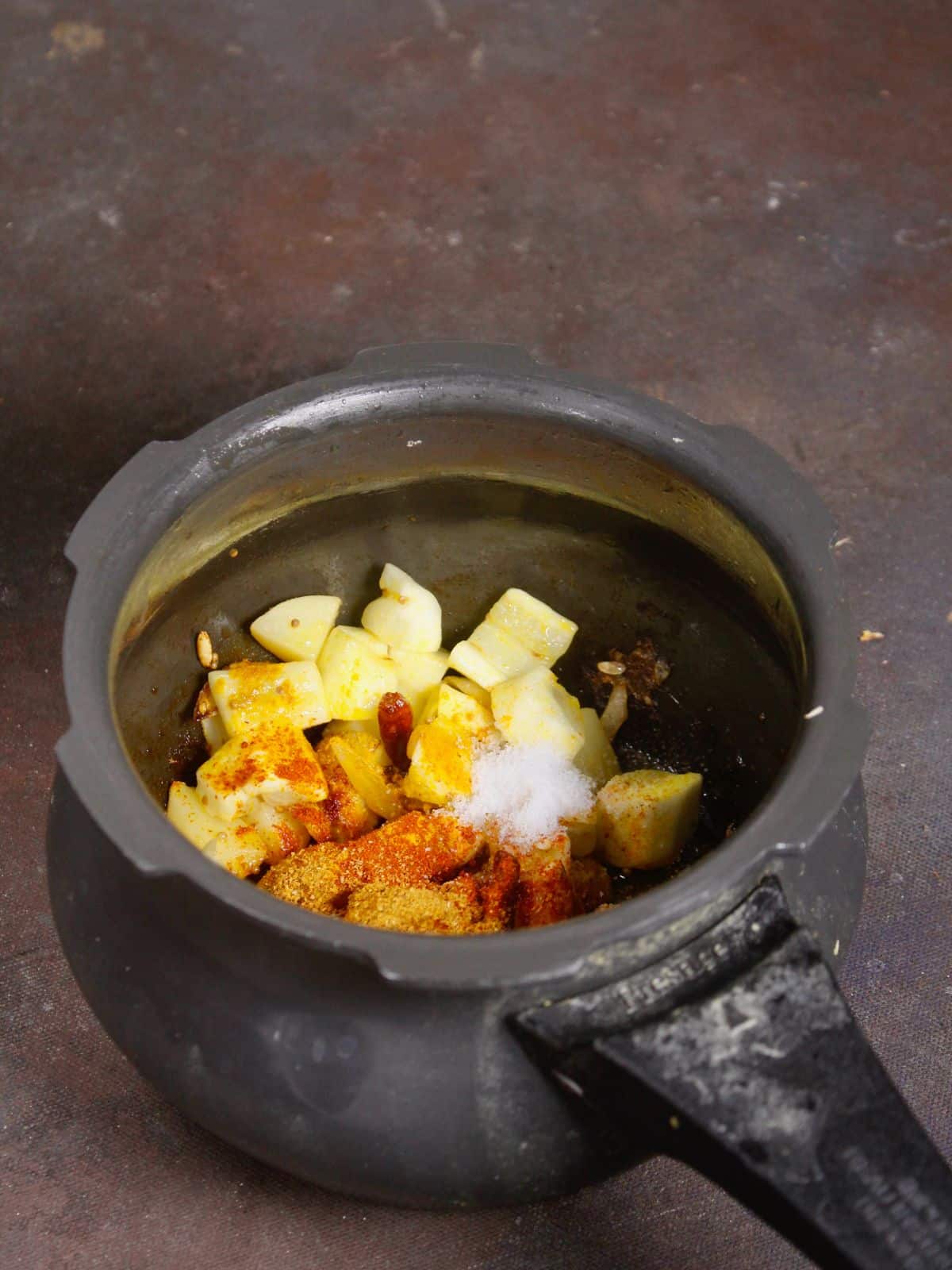 add powdered spices to the cooker 