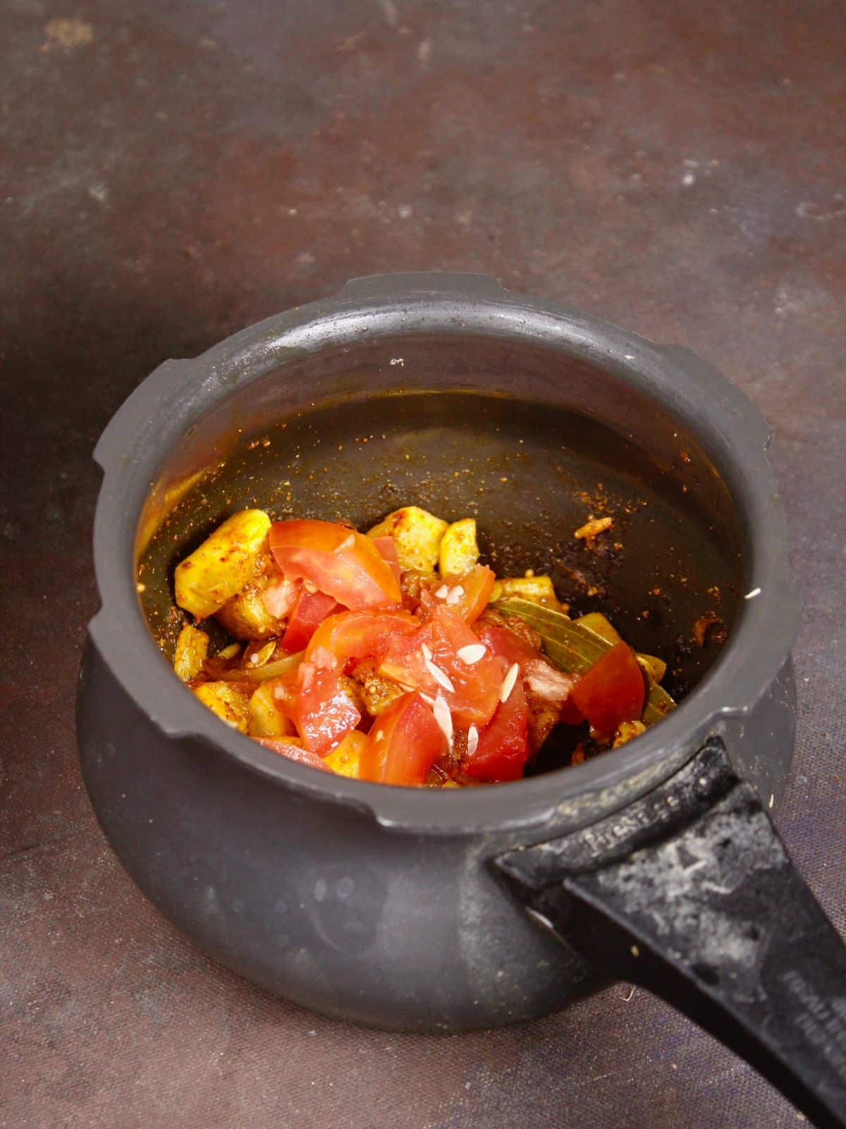 add chopped tomatoes to the cooker 