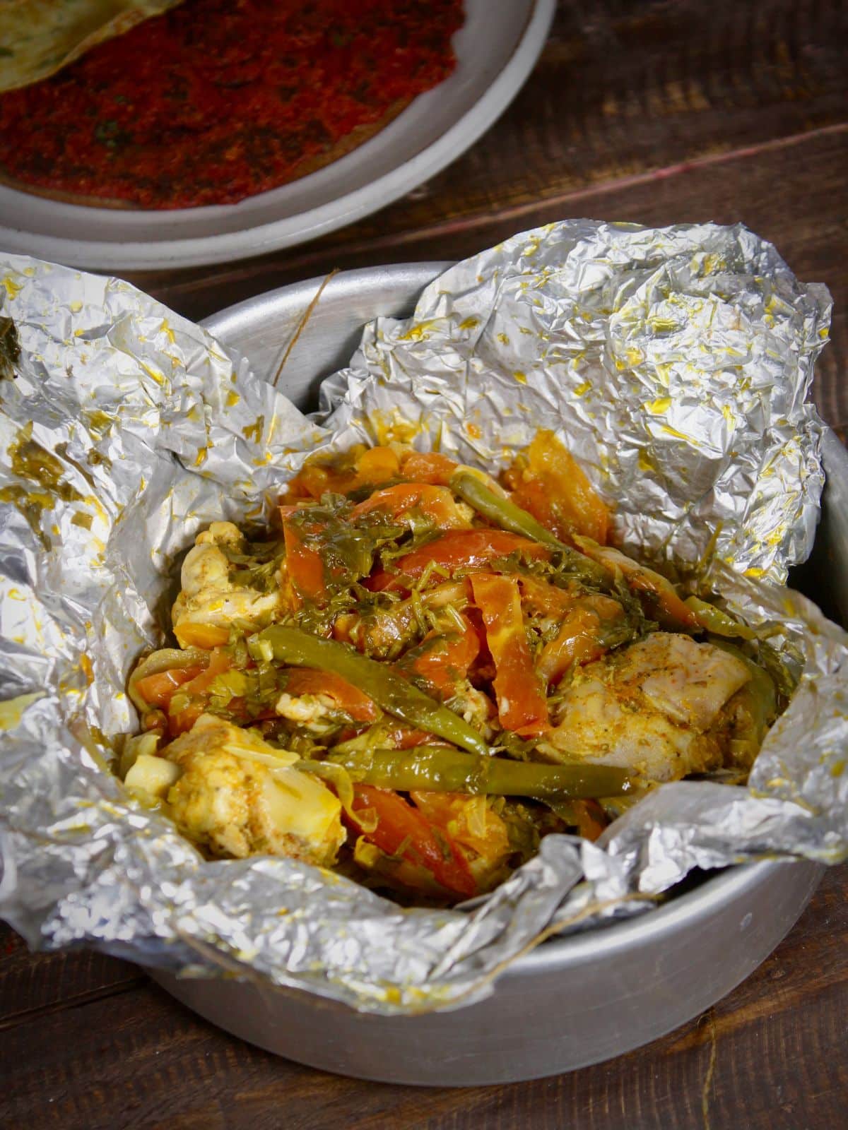 yummy steamed chicken in alluminium foil is ready to enjoy with roti