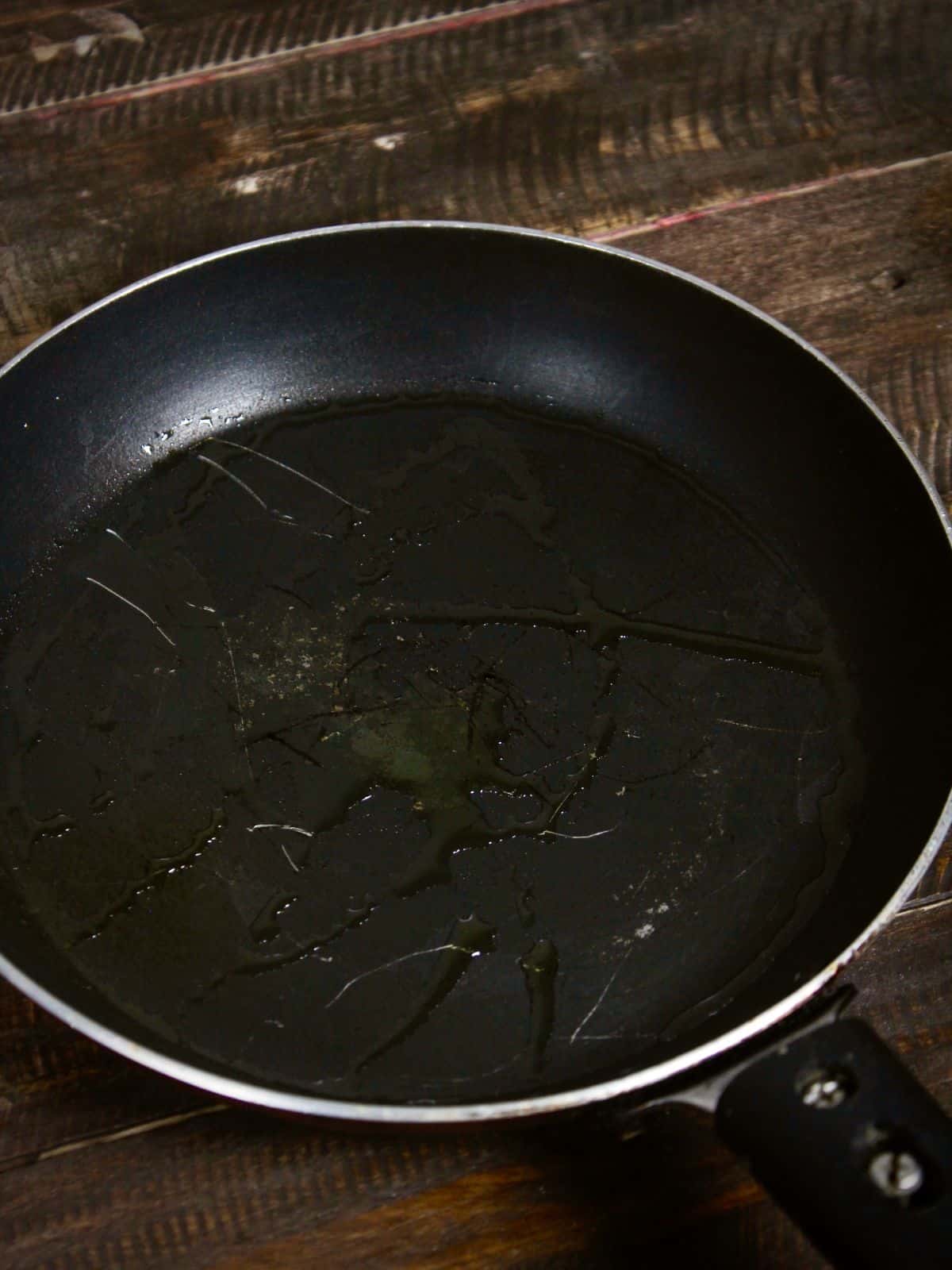 take oil in a pan 