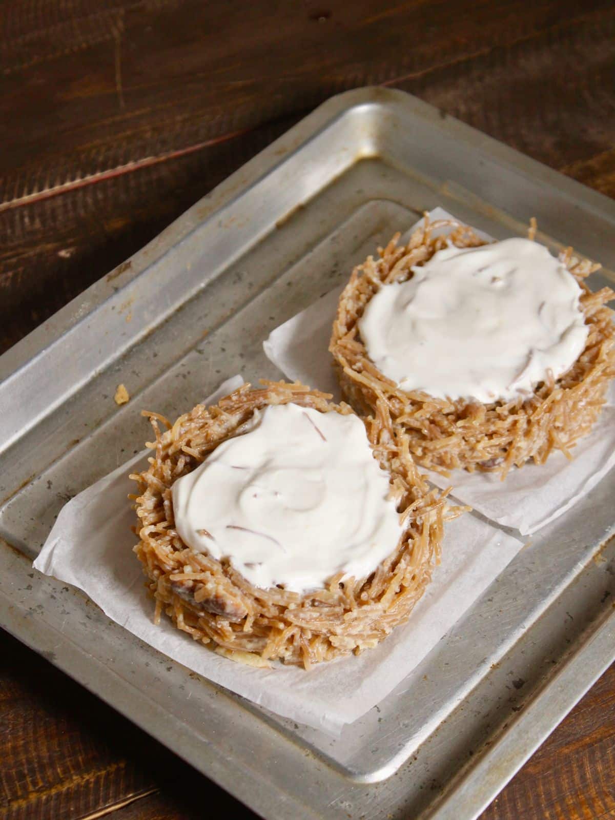 apply cream over the top vermicelli rings and bake it for 15 mins