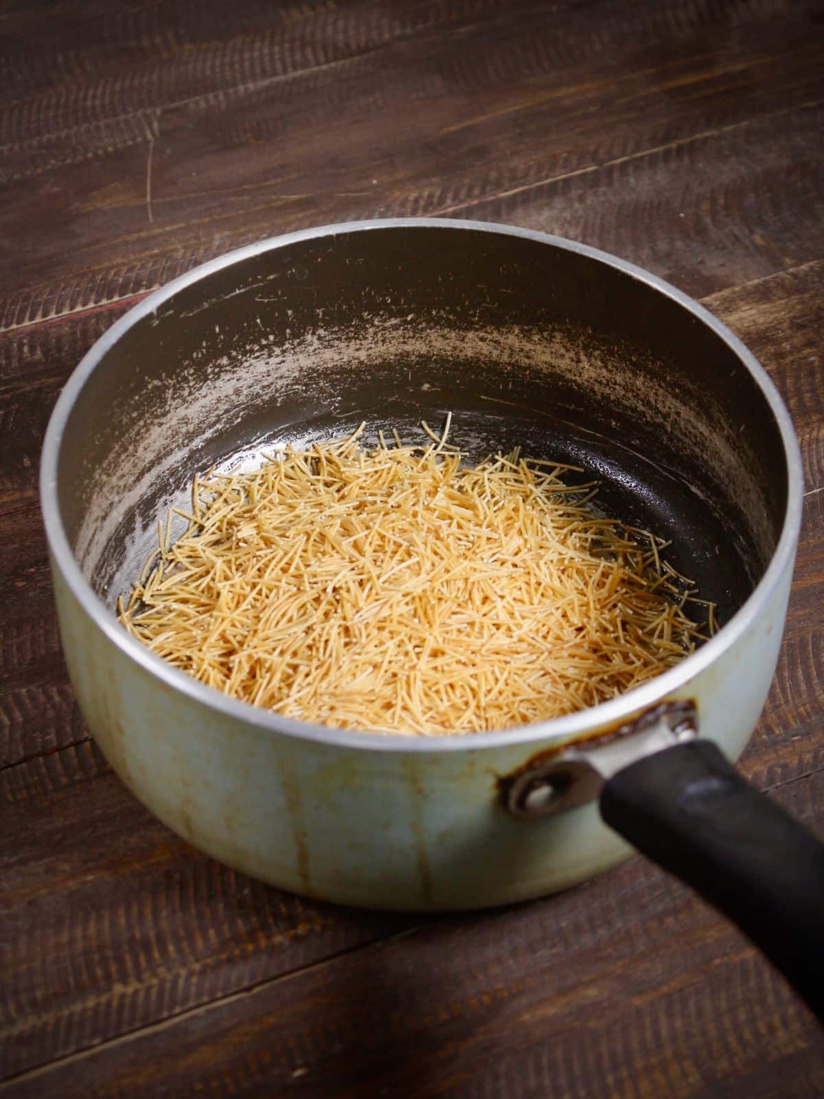 take ghee and vermicelli in a pan and saute 