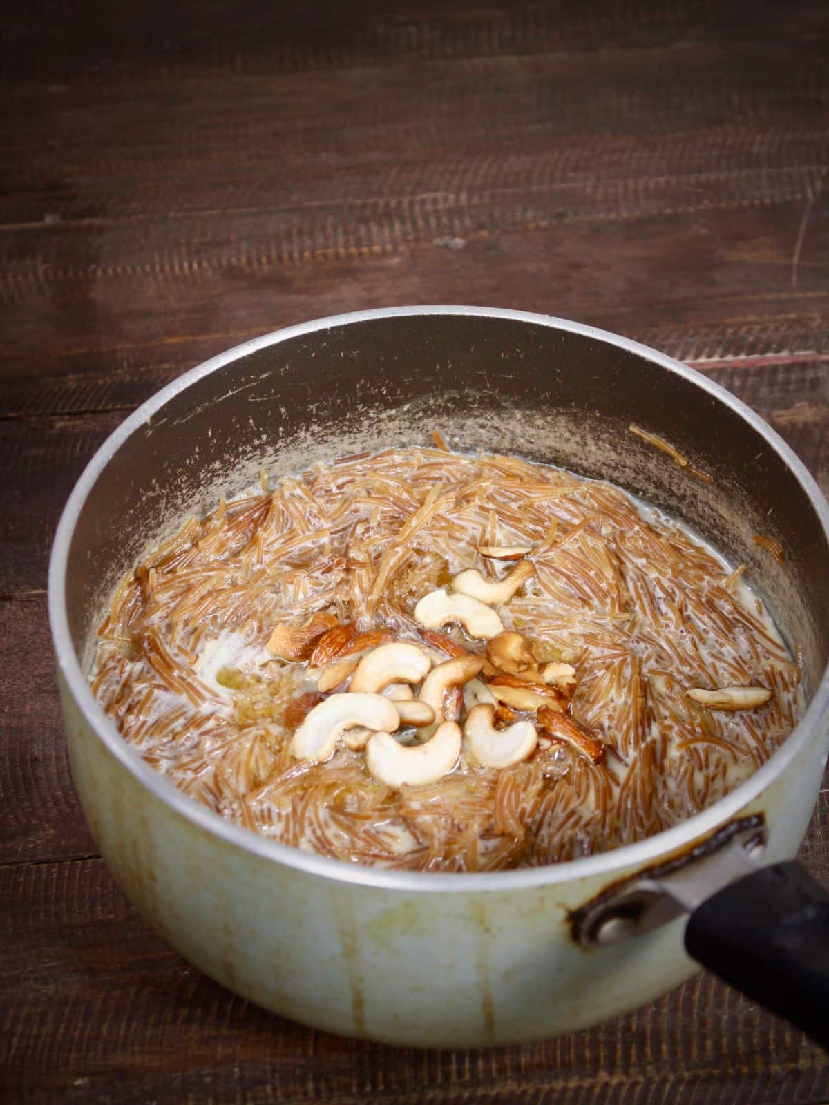 transfer the roasted dry fruits into the vermicelli mixture and mix well properly 