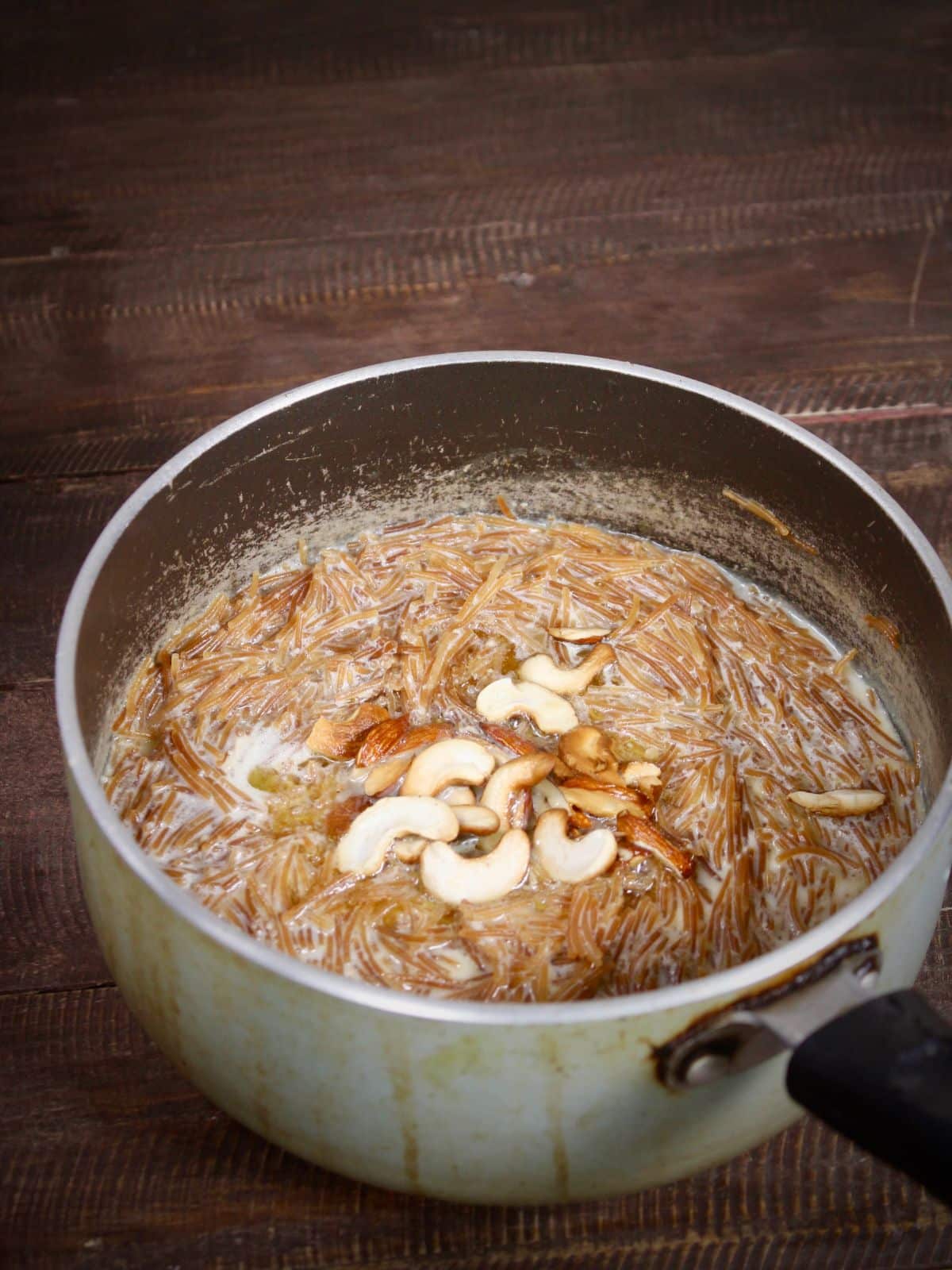 transfer roasted dry fruits on vermicelli mixture and mix well