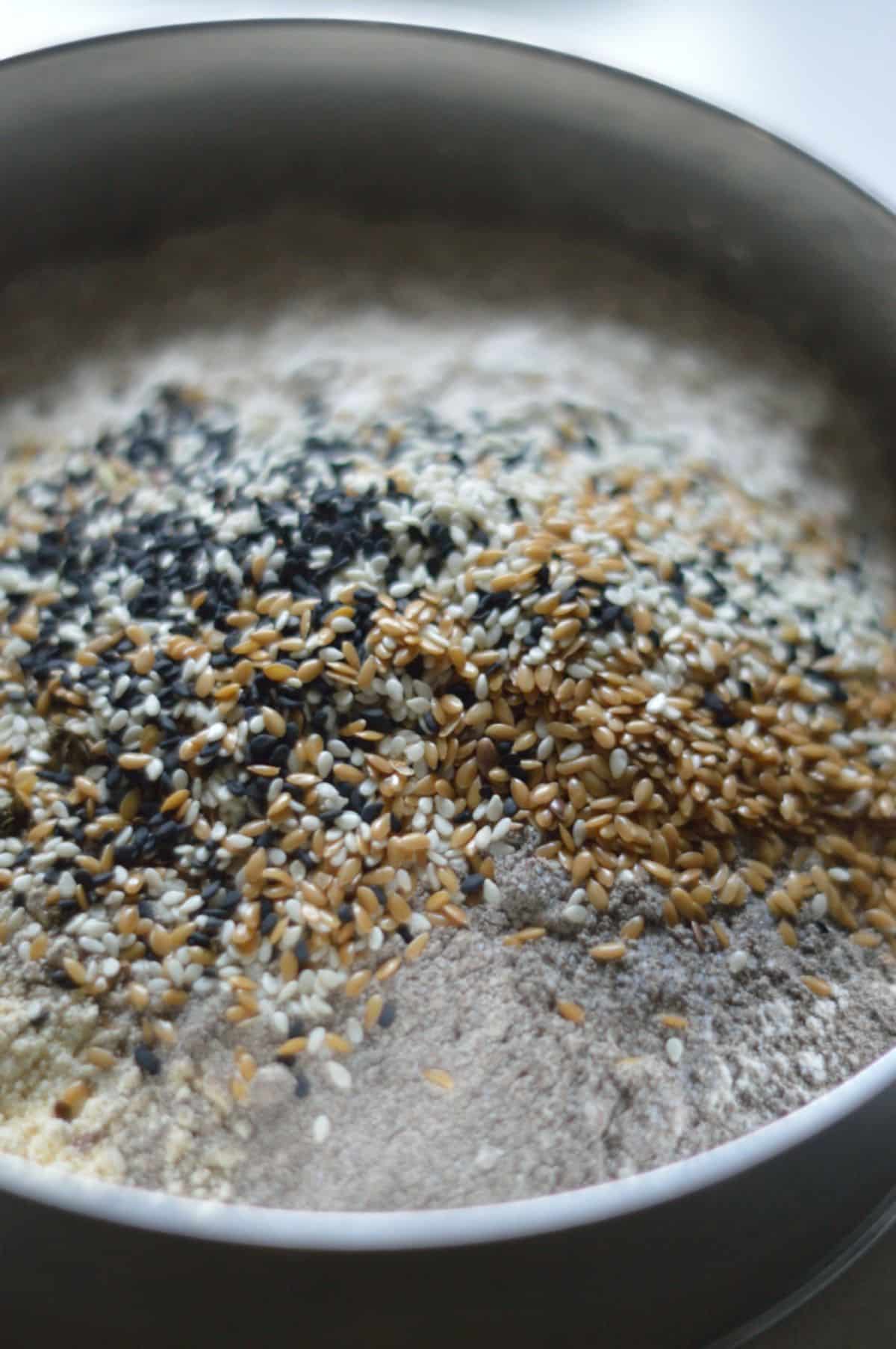 MIxed seeds and flour in a bowl.