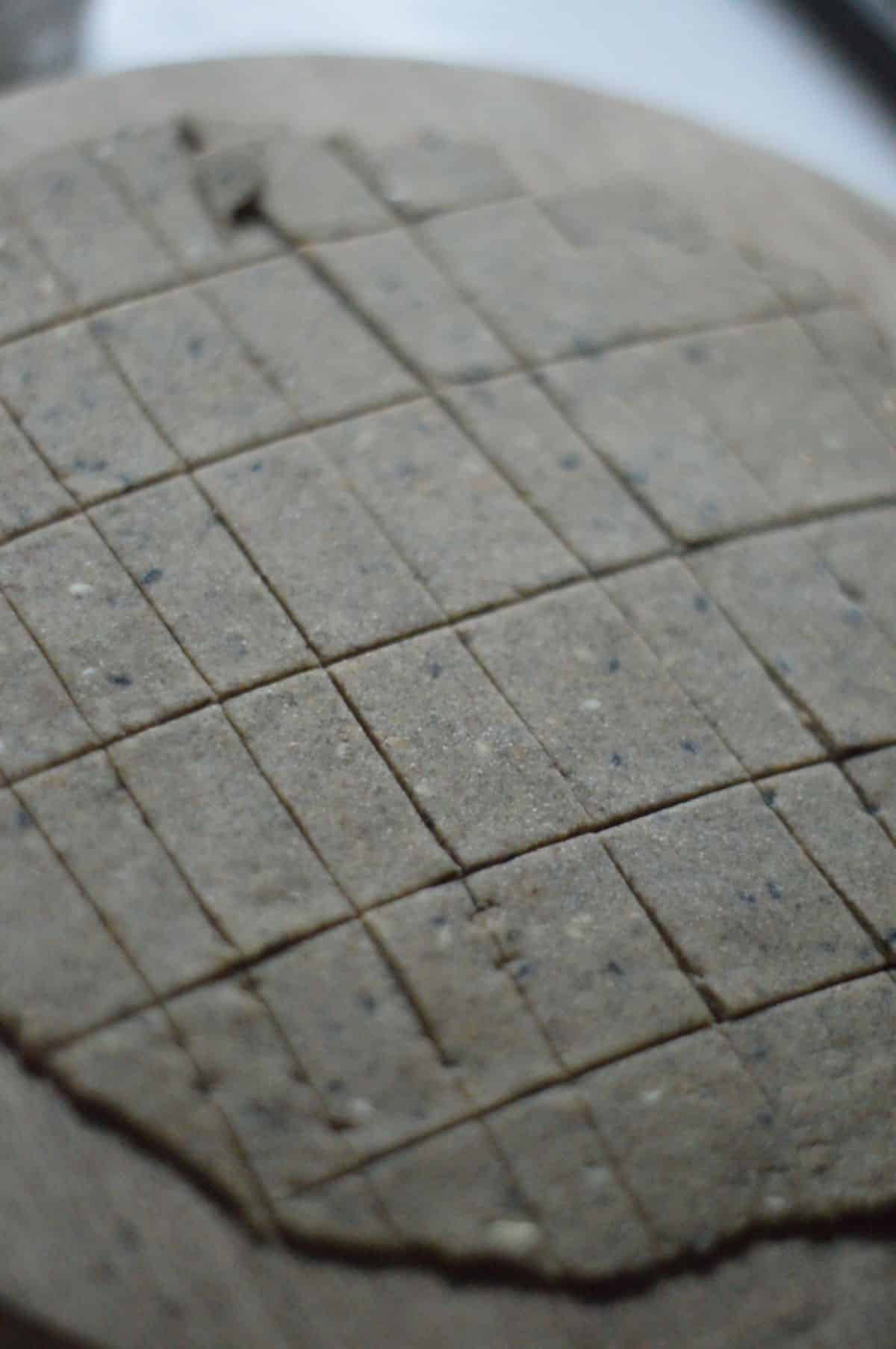 Air Fryer Cracker dough cutted in small squares.