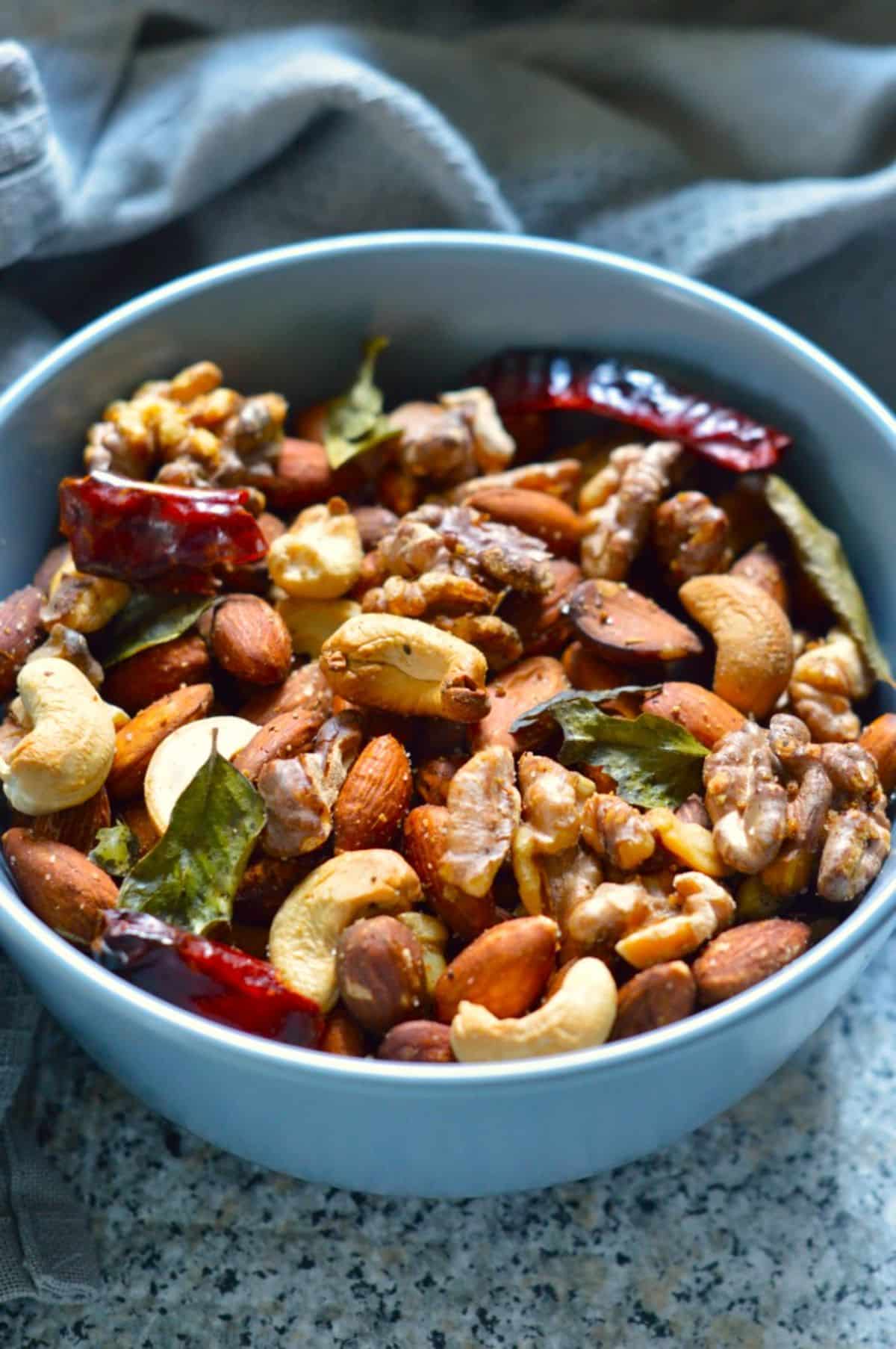 Air-Fryer Nuts in a blue bowl.