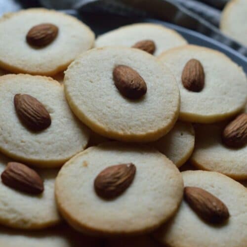 Badam Cookies on a gray tray.