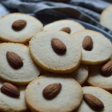 Badam Cookies on a gray tray.